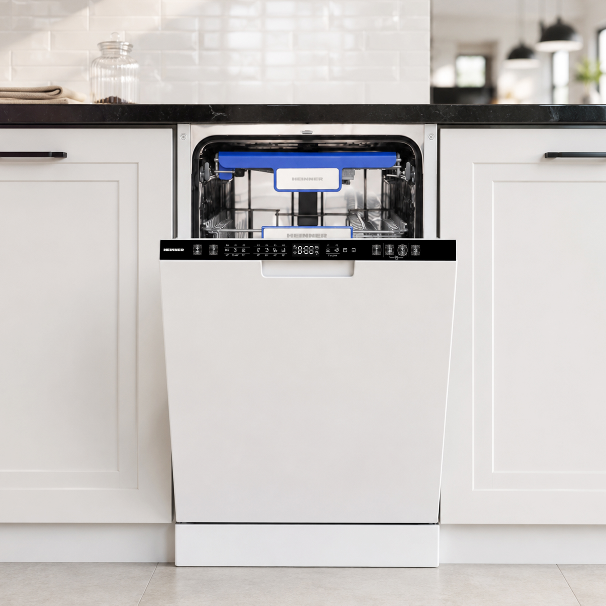 A white Heinner dishwasher with its door open sits built into a modern kitchen with white cabinets.