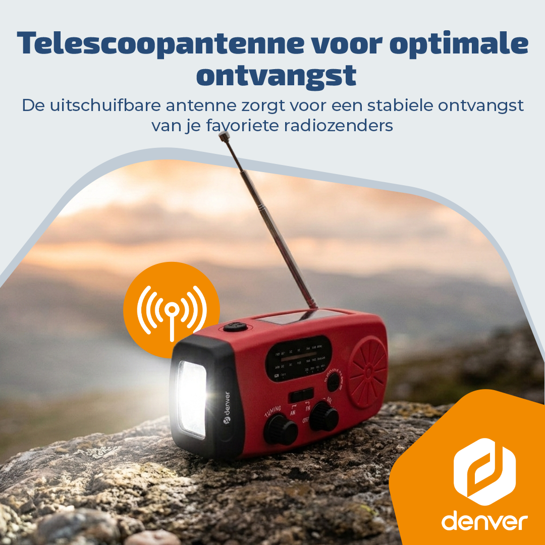 Ein rotes Notfallradio mit ausziehbarer Antenne und heller Taschenlampe auf einem felsigen Untergrund.
