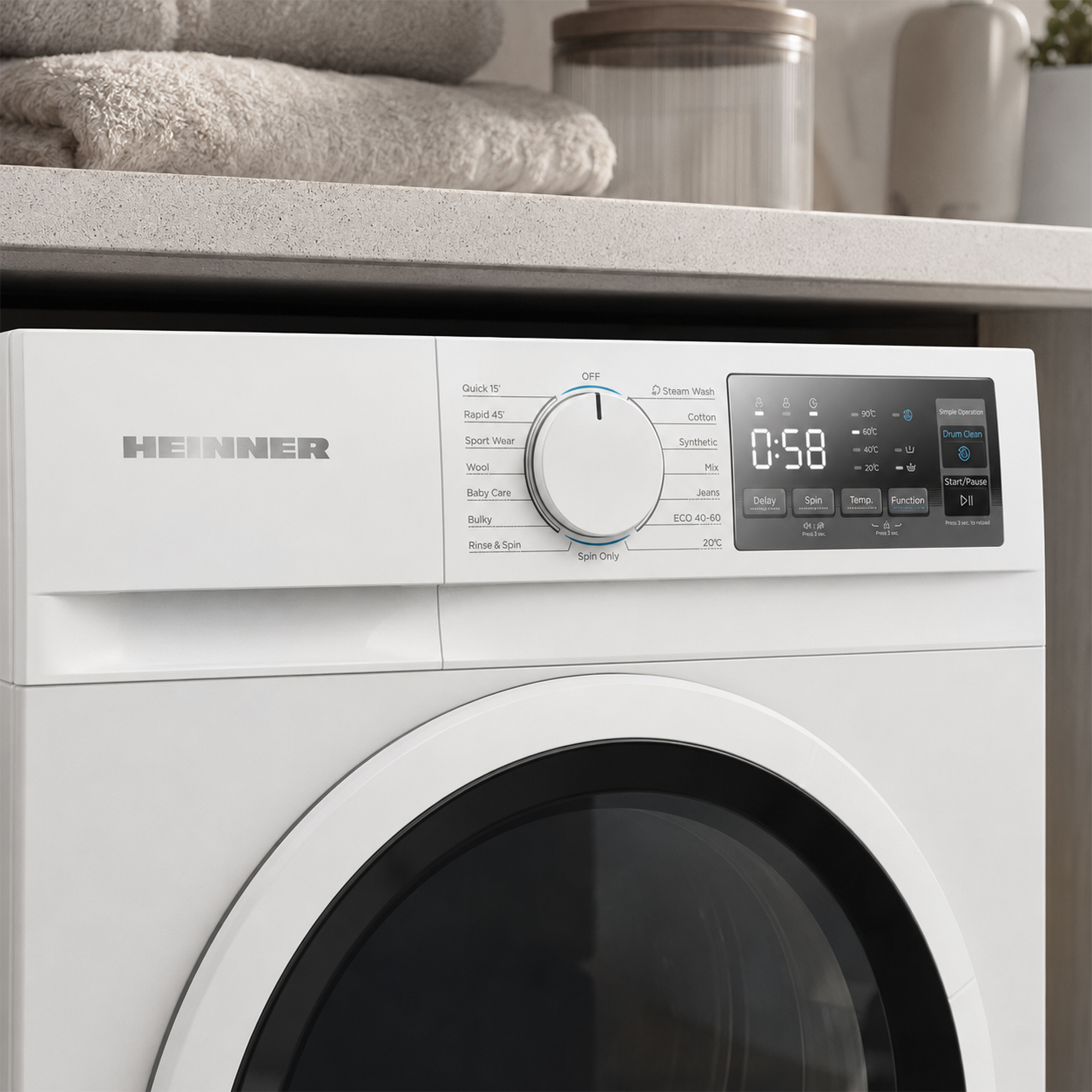 Panneau de commande de lave-linge Heinner blanc avec affichage numérique, sélecteur rotatif et boutons.