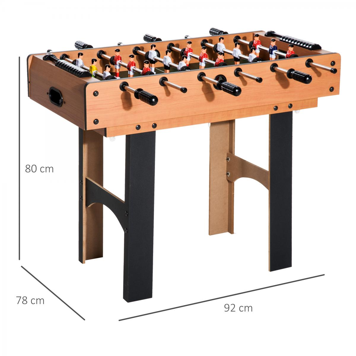 Ein Kicker aus Holz mit schwarzen Beinen, Metallstangen und Spielfiguren, mit Abmessungen von 80x78x92 cm.