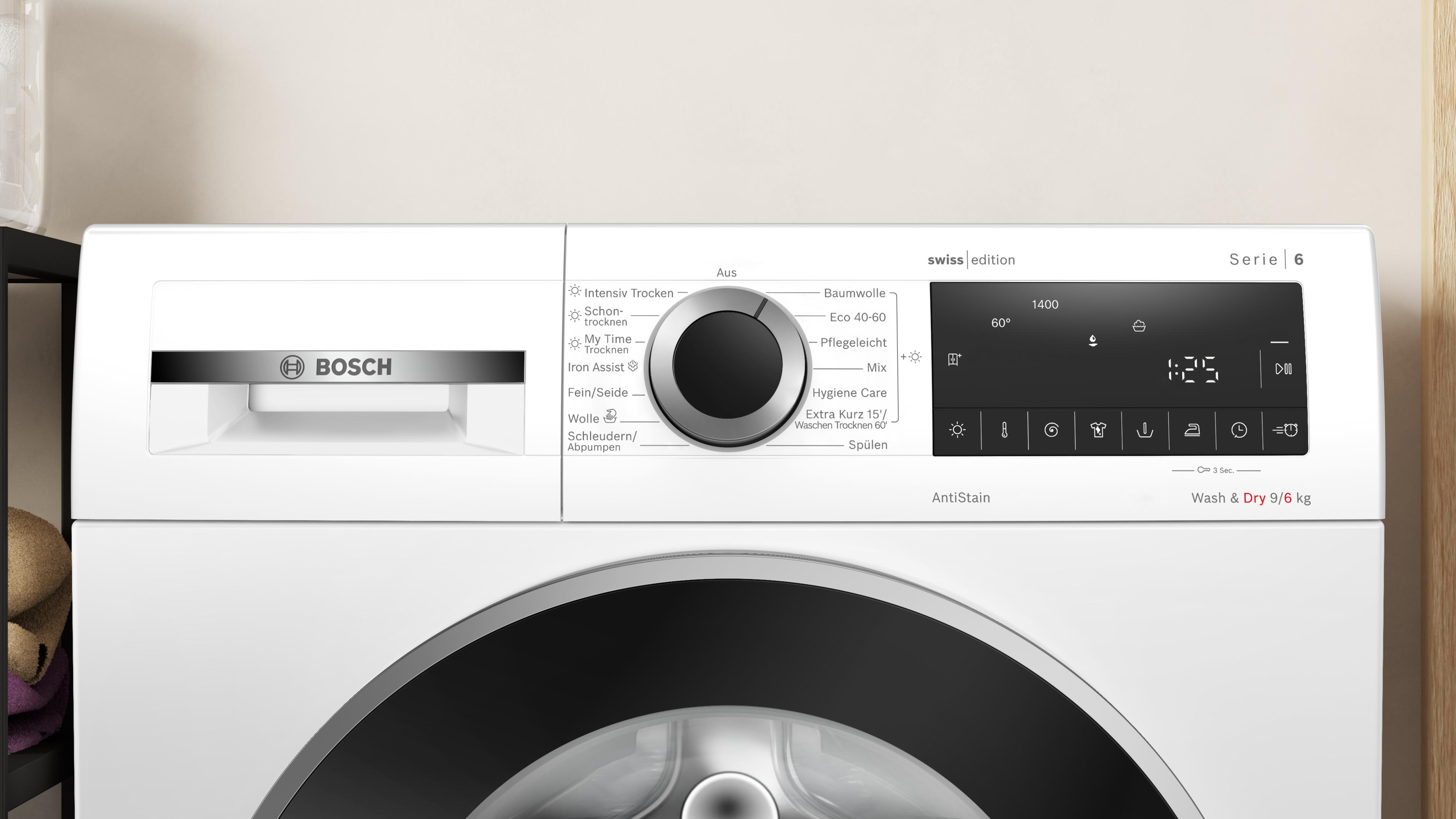 Vue de face d'un lave-linge blanc Bosch Serie 6 avec écran numérique, sélecteur rotatif et bac à produits.