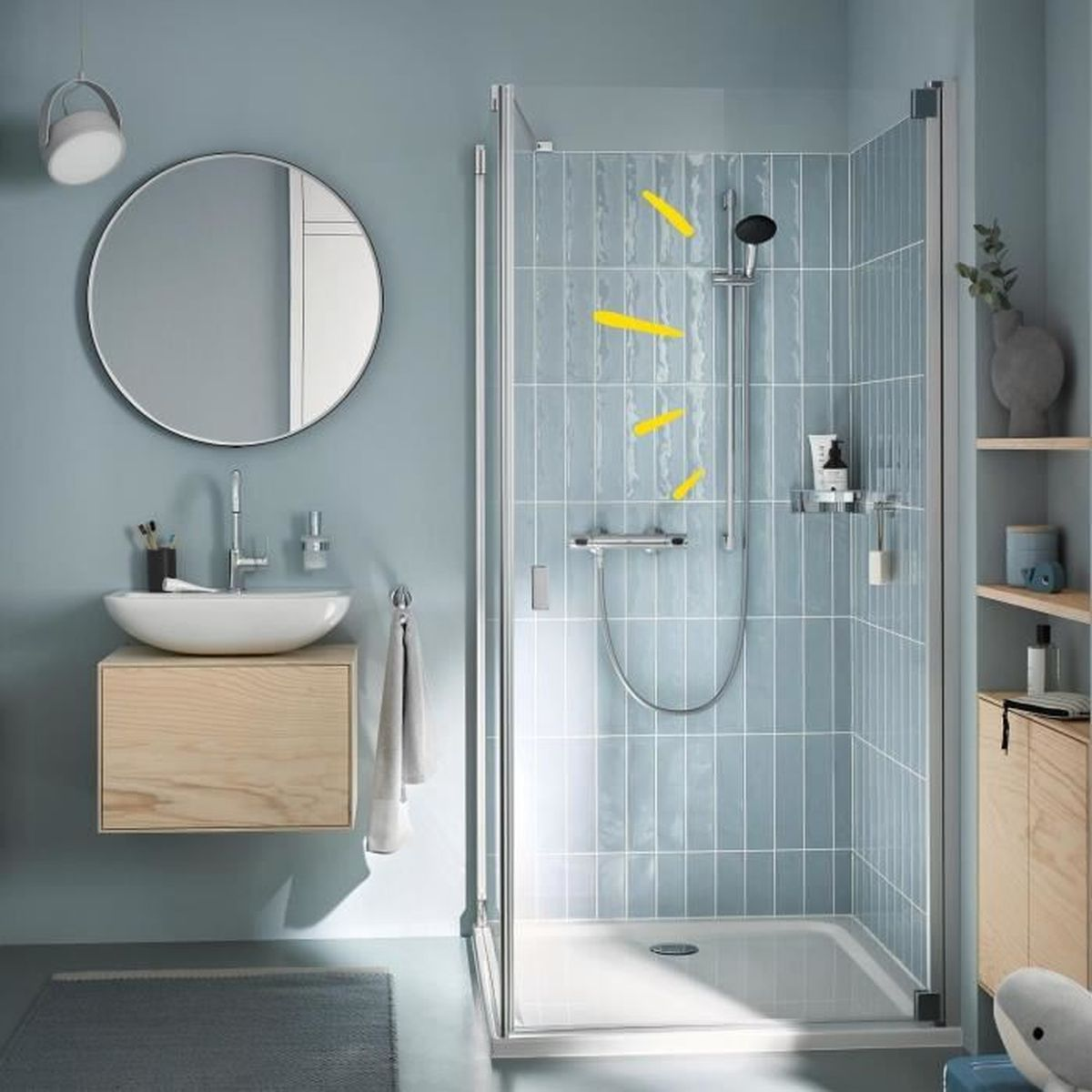 Ein modernes Badezimmer mit blau-grauen Wänden, einer Glasdusche, einem Waschbecken und Holzmöbeln.