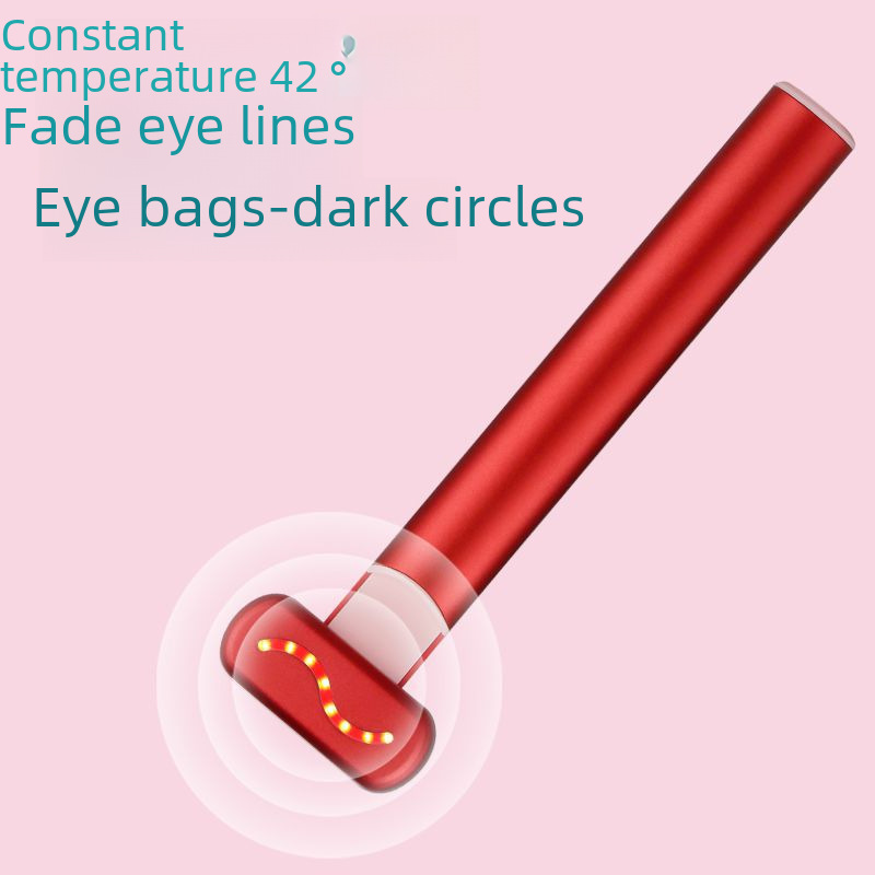 Ein rotes Hautpflegegerät mit leuchtendem Wellenmuster auf rosa Hintergrund.