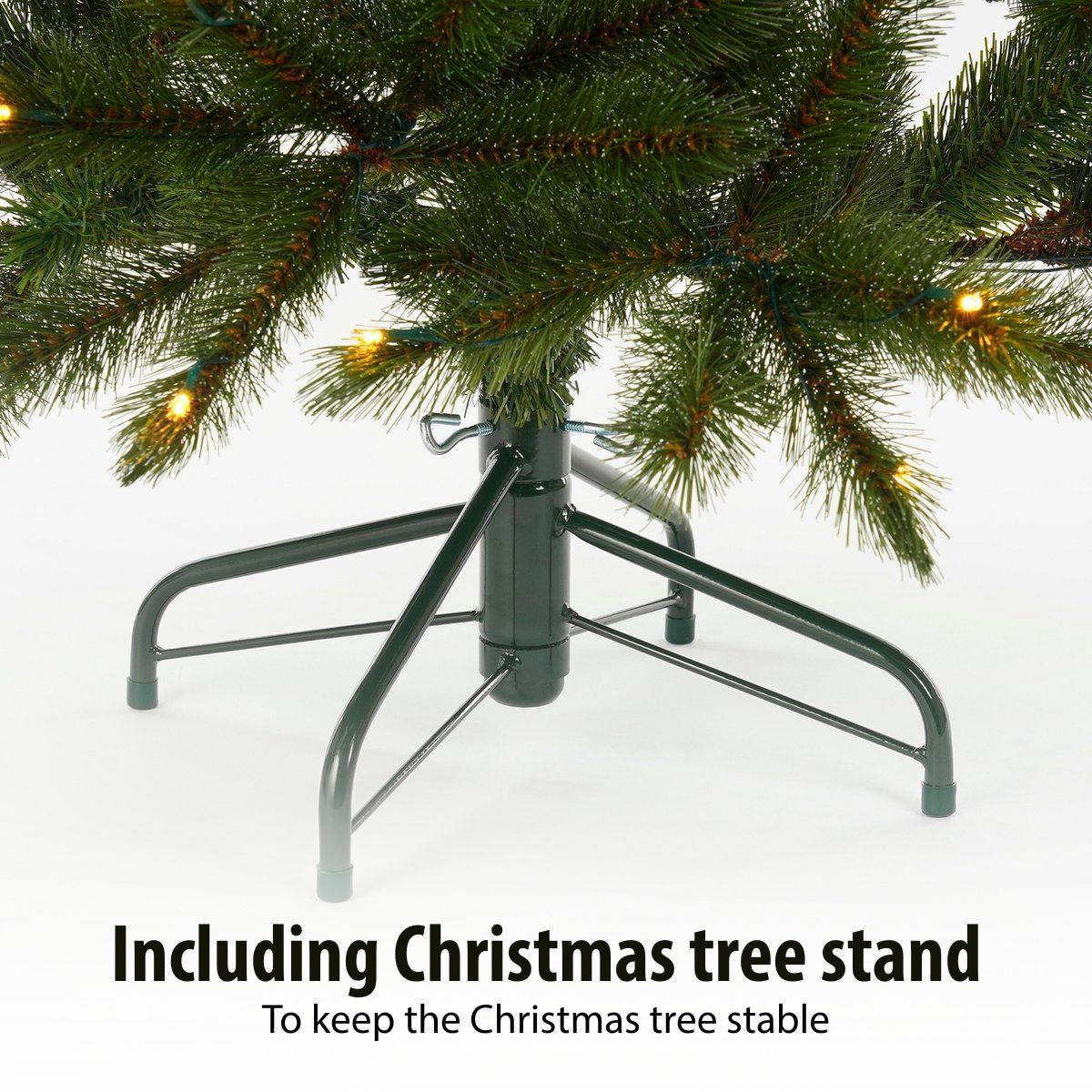 Green metal Christmas tree stand supporting an artificial tree.