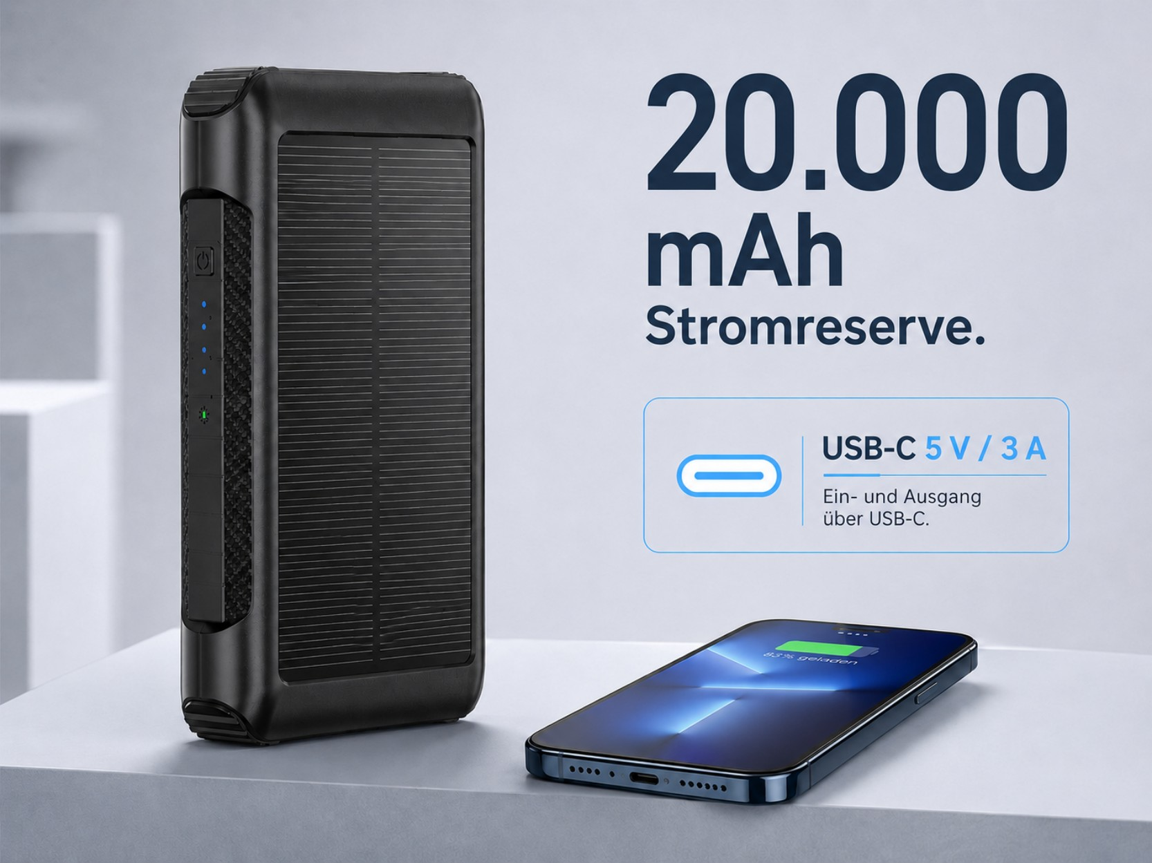 Eine schwarze 20.000 mAh Solar-Powerbank und ein Smartphone liegen auf einer weißen Oberfläche mit deutschem Werbetext.
