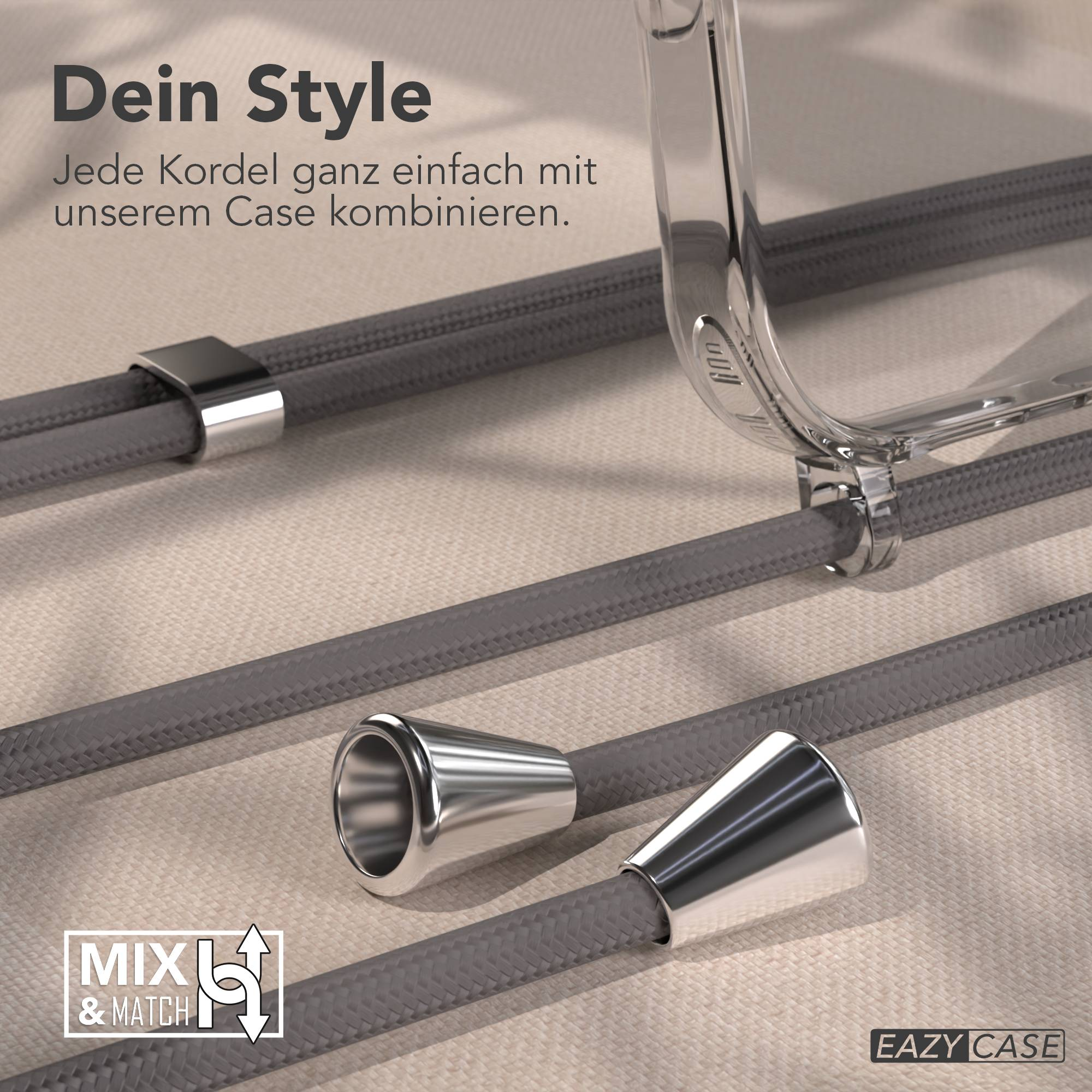 Eine transparente Handysülle mit grauen Kordeln und silbernen Metallakzenten auf beige.