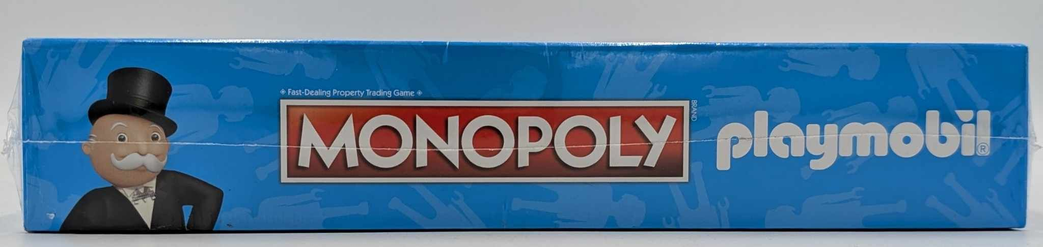 Blaues Monopoly Playmobil Brettspiel mit Mr. Monopoly links.