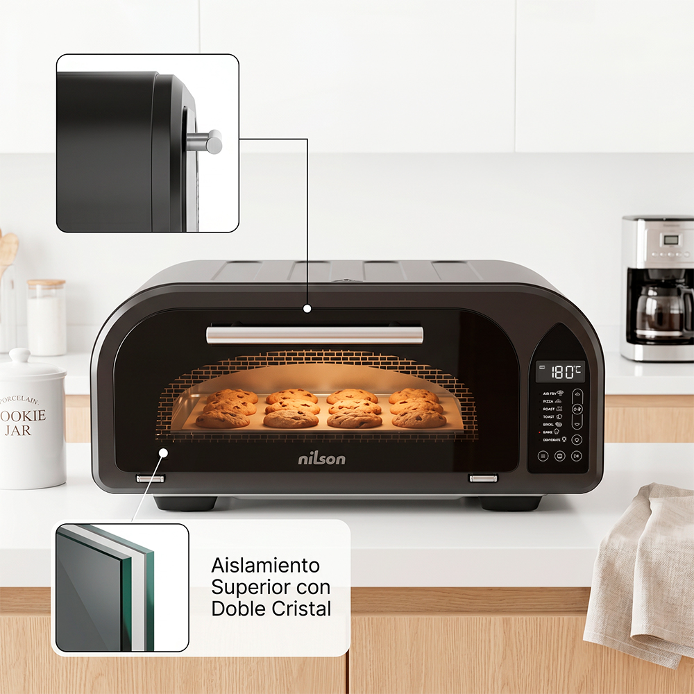 Un horno negro de sobremesa con galletas horneándose, doble cristal y controles digitales.