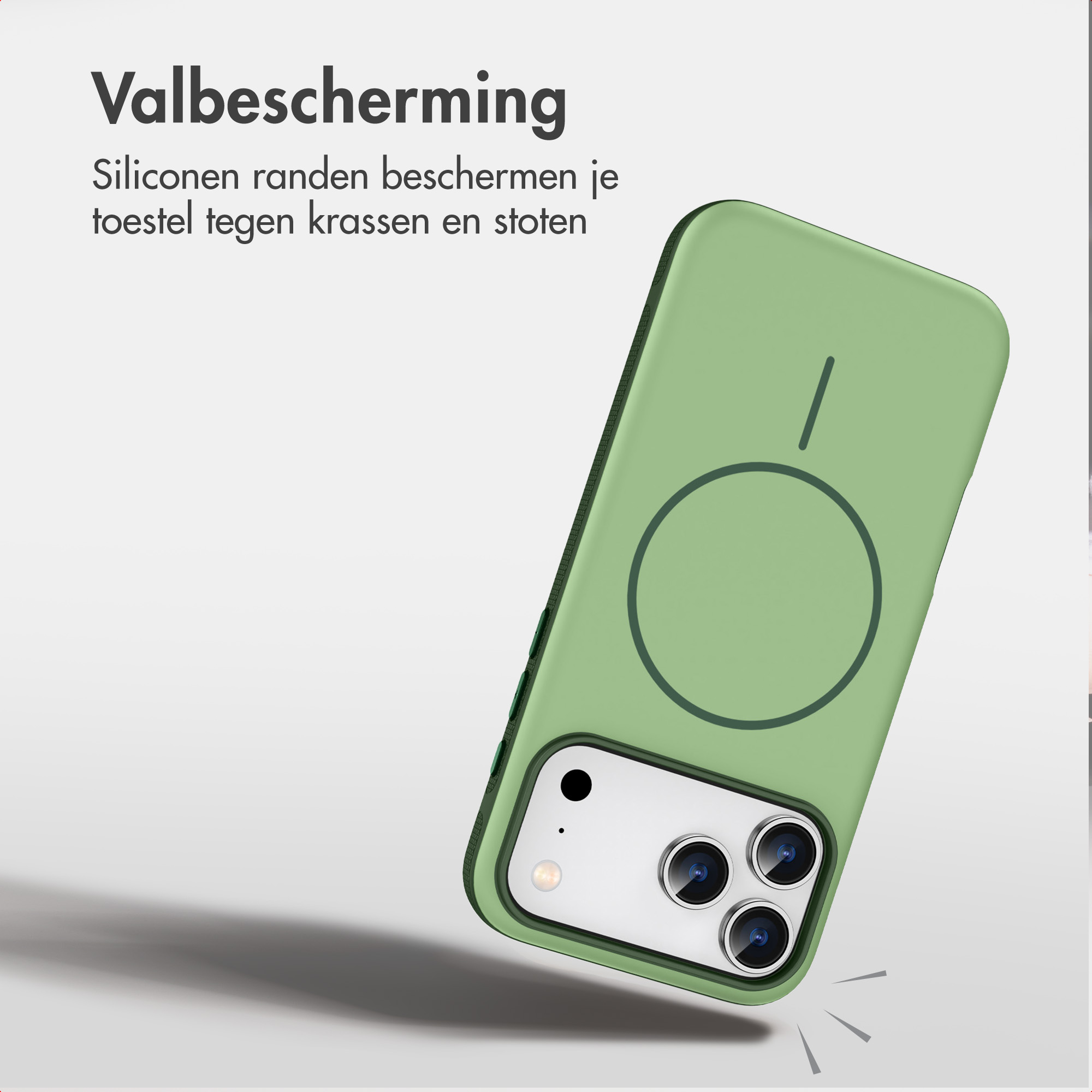 Grüne Silikon-Handyhülle mit MagSafe-Kreis und Kameraausschnitt vor hellem Hintergrund.