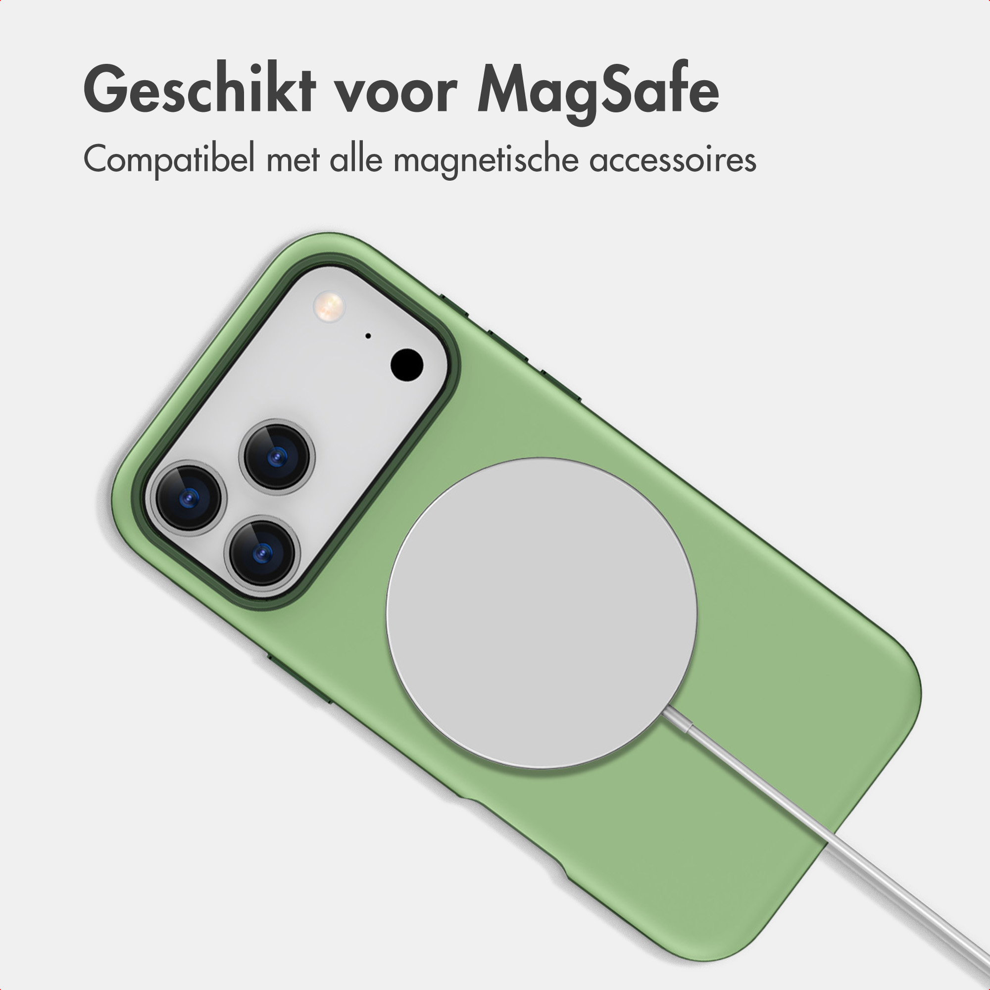 Grünes Smartphone mit Hülle und weißem MagSafe-Ladegerät.