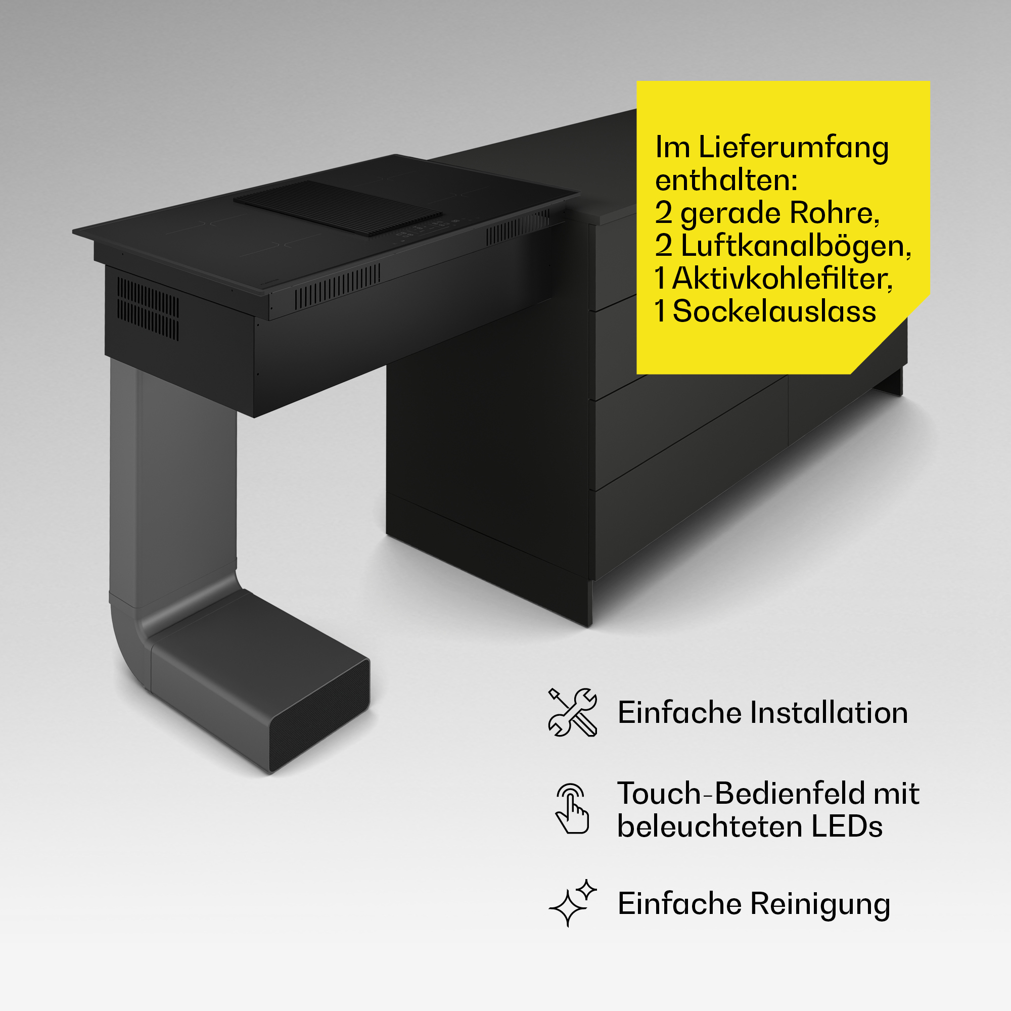 Piano cottura nero con estrattore integrato e condotti, con testo su giallo e sfondo bianco.
