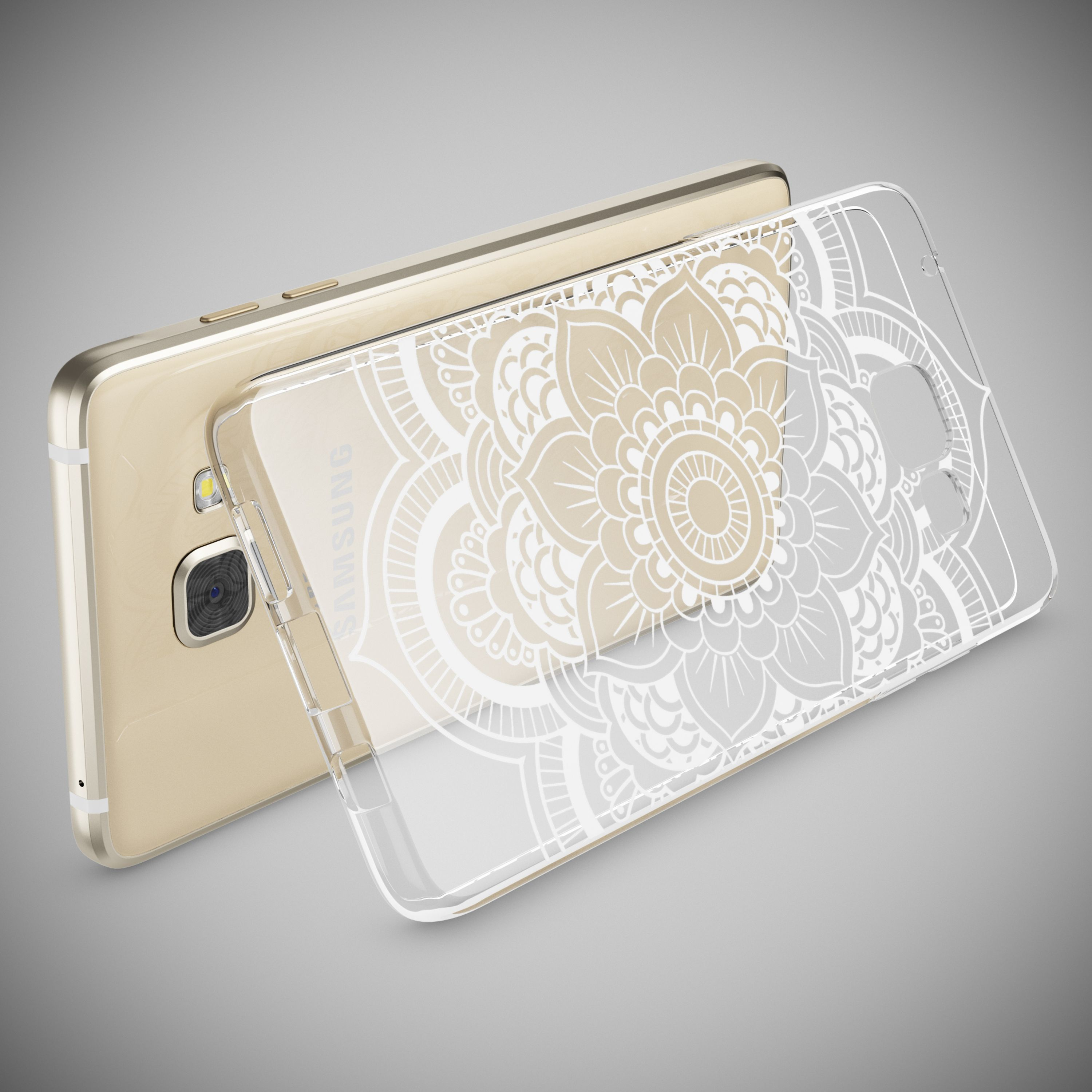 Ein goldenes Smartphone liegt neben einer transparenten Schutzhülle mit weißem Mandara-Muster vor grauem Hintergrund.