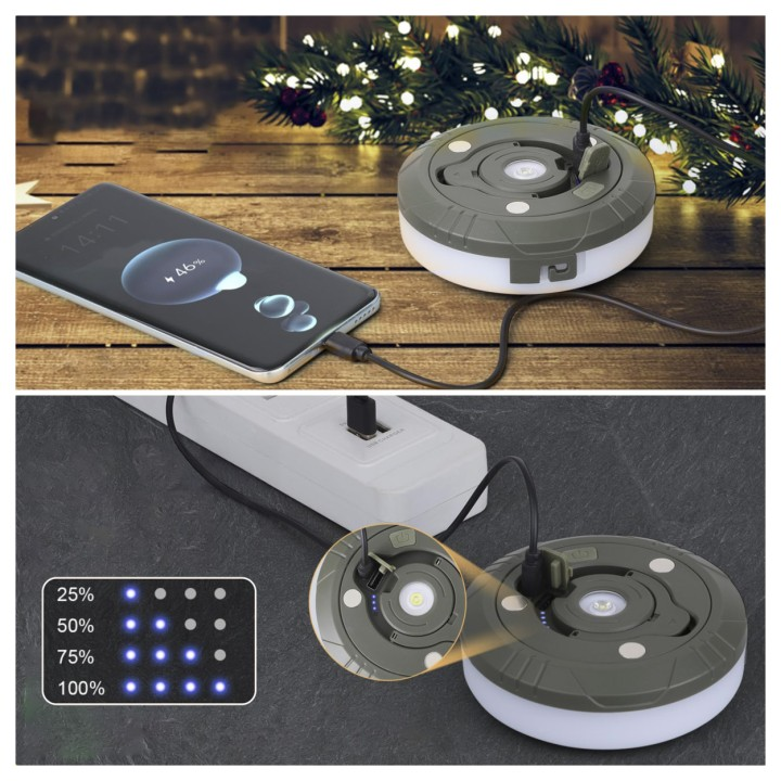 Grüne tragbare LED-Lampe lädt ein Smartphone auf und zeigt den Akkustand an.