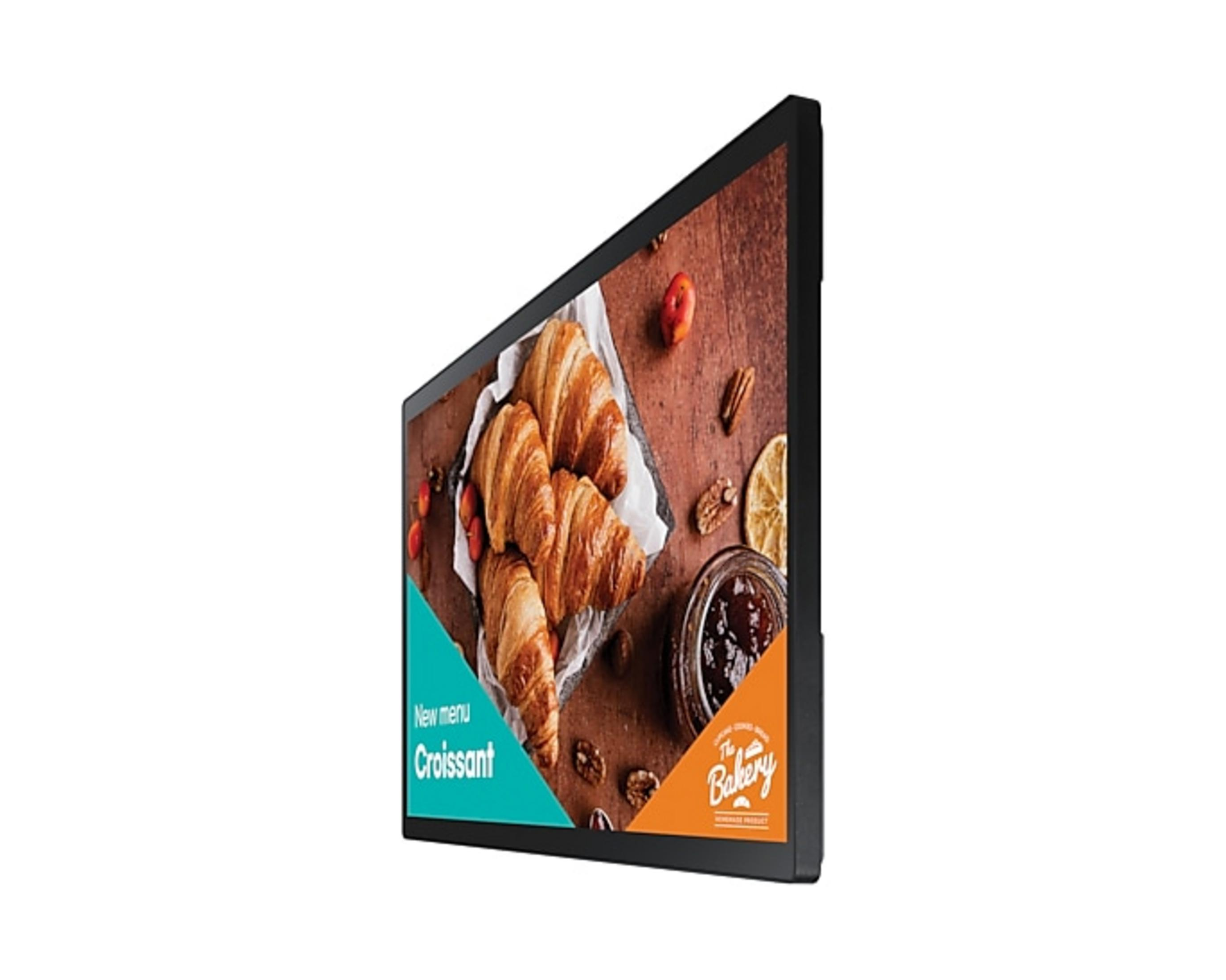 Uno schermo digitale orizzontale mostra un menu di croissant con dolci freschi sul legno.