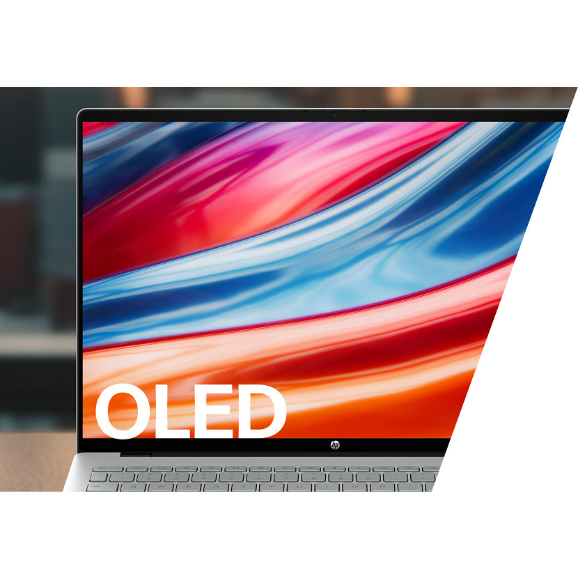 HP-Laptop mit buntem OLED-Bildschirm und weißer Tastatur in einem Raum.
