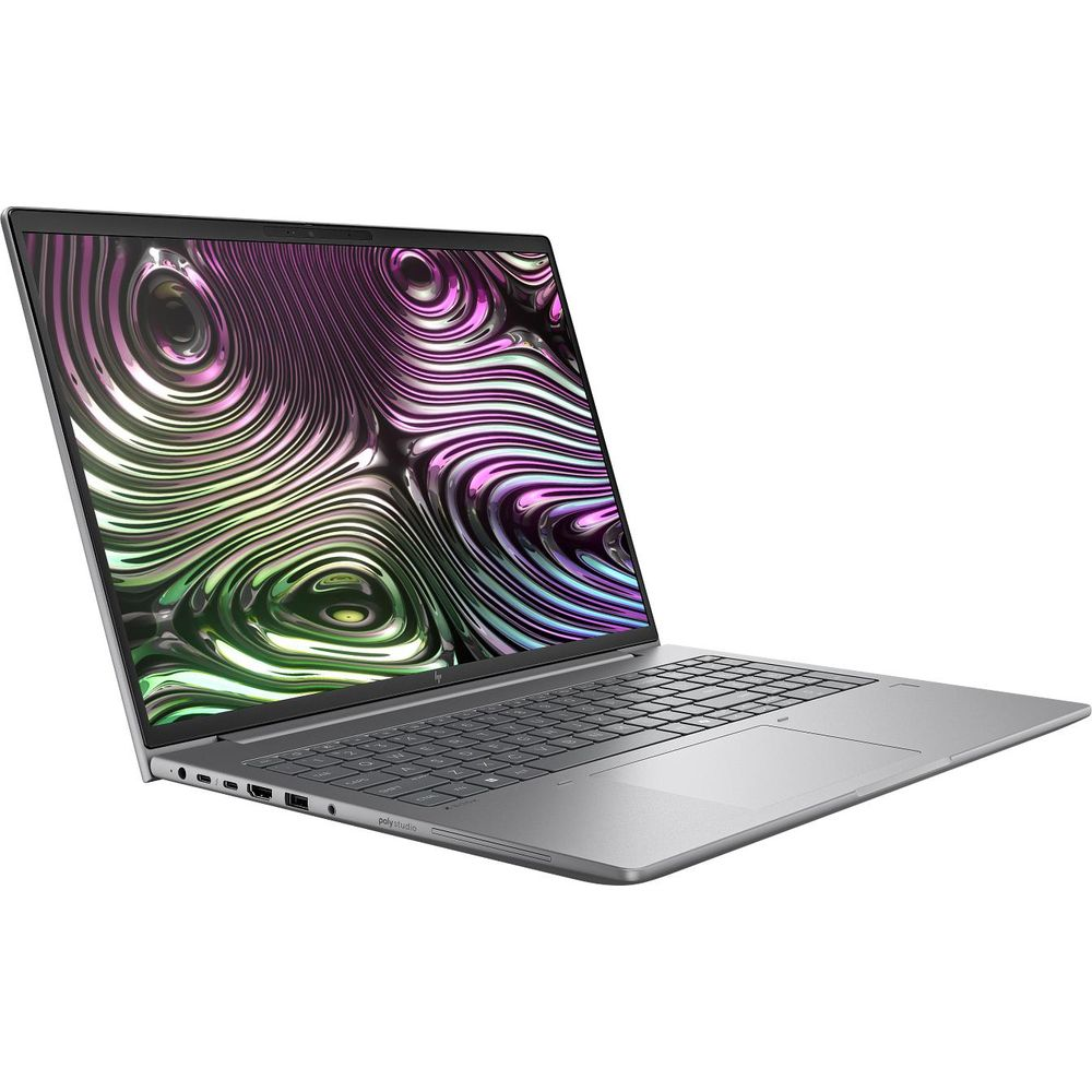 Un computer portatile argentato con uno sfondo astratto colorato sullo schermo si trova su una superficie bianca.