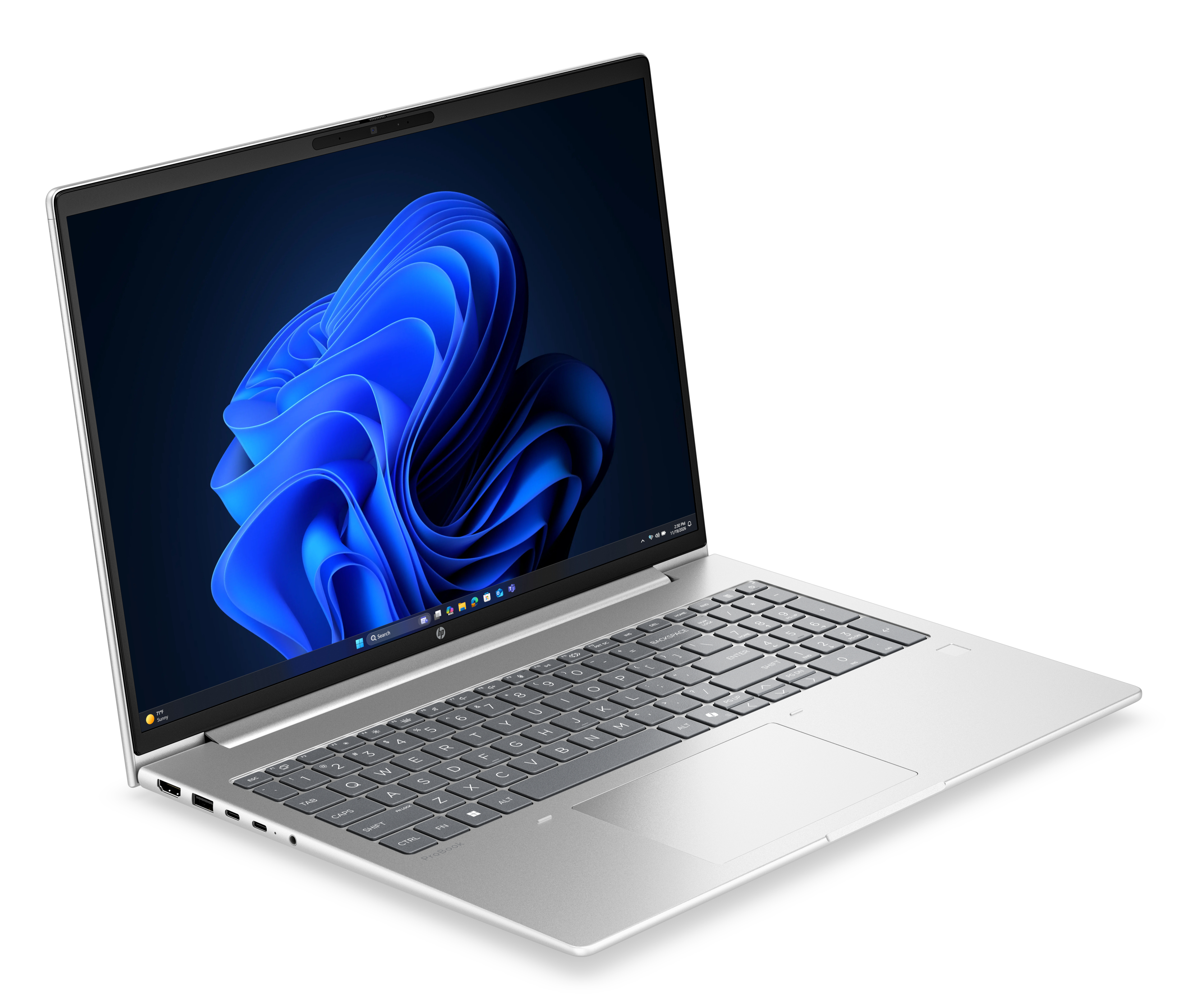 Un computer portatile argentato con uno sfondo blu di Windows sullo schermo è visto da una prospettiva angolata.
