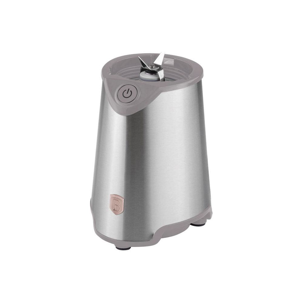 Une base de blender argentée avec des accents gris et des lames sur fond blanc.