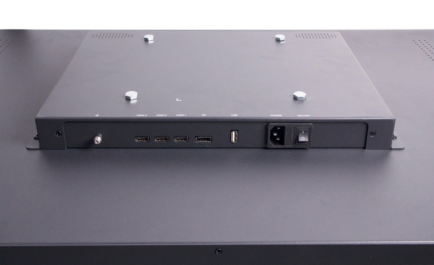 Retro di un display nero con porte HDMI, DisplayPort, USB e di alimentazione, oltre a un interruttore.