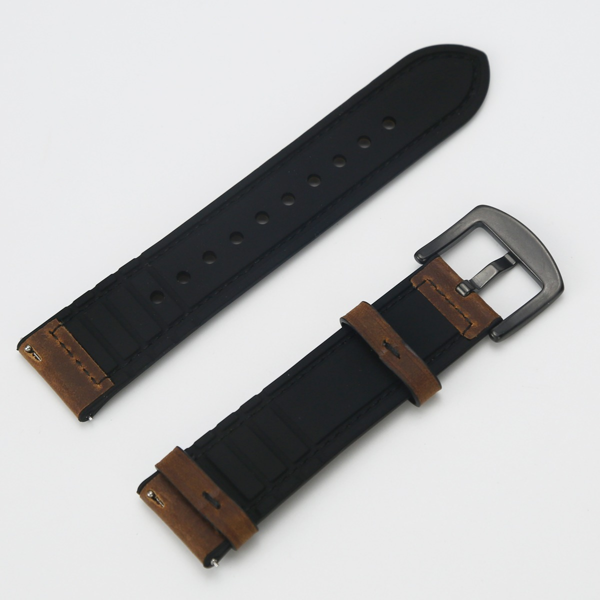 Zwei schwarze Uhrenarmbänder mit braunen Lederakzenten und einer dunklen Schnalle auf hellem Hintergrund.