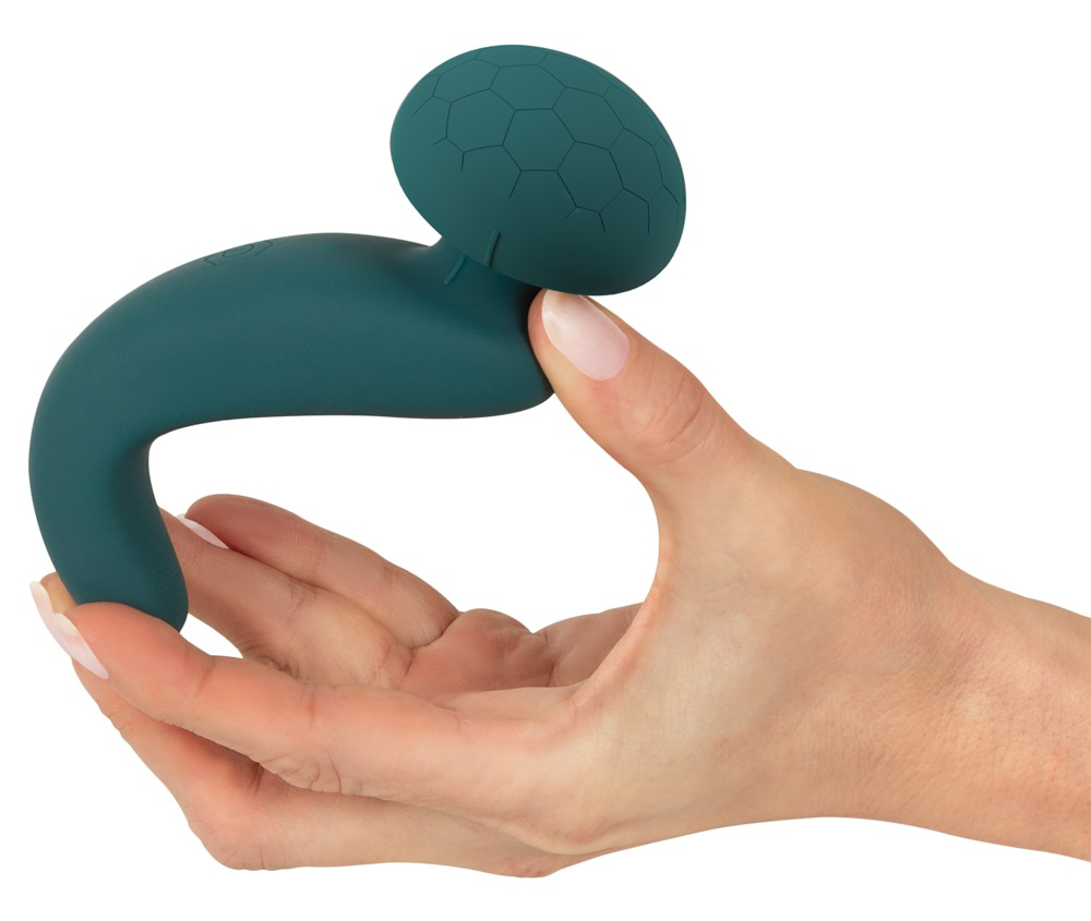 Eine Hand hält ein teal-farbenes, geschwungenes Wellness-Gerät mit einer strukturierten Kugel.