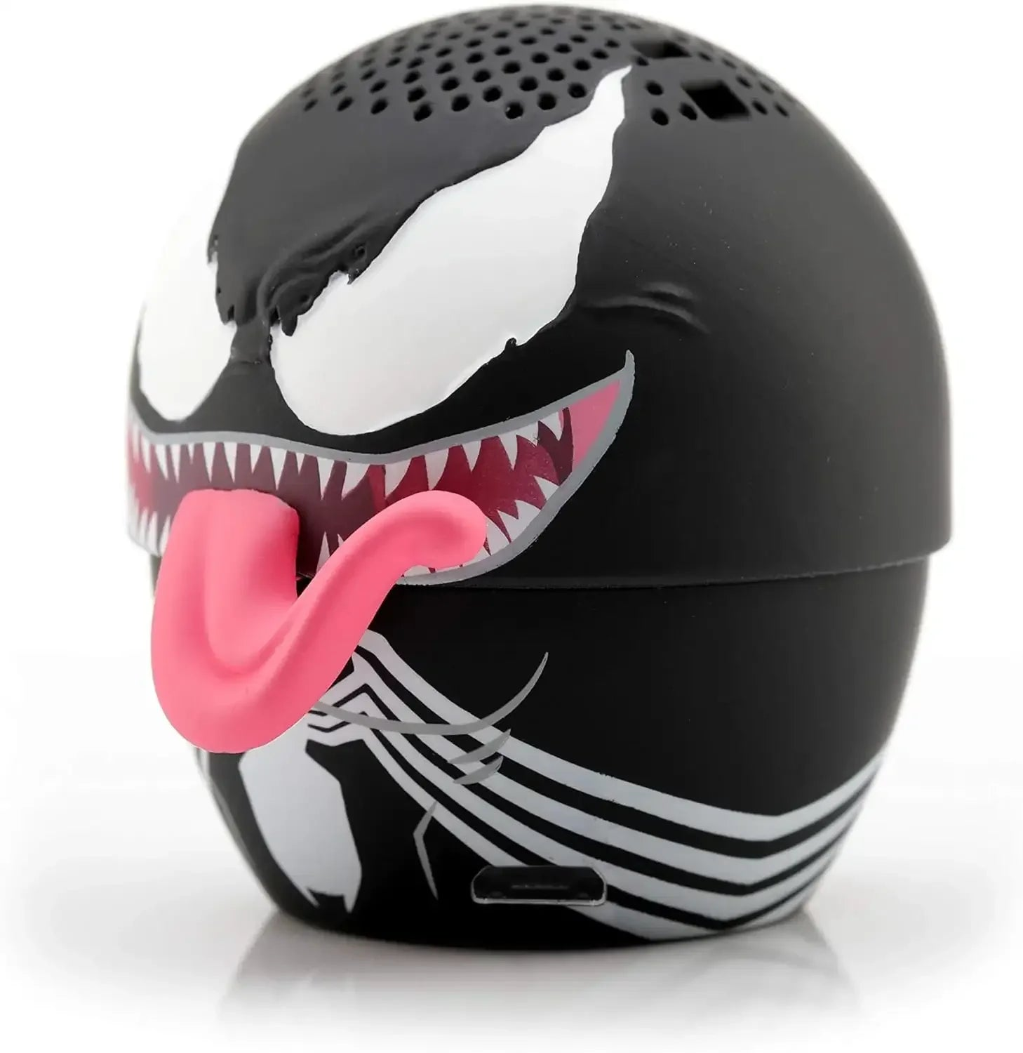 Mały, okrągły, czarny głośnik Bluetooth przedstawiający twarz Venoma z białymi oczami, ostrymi zębami i długim różowym językiem.