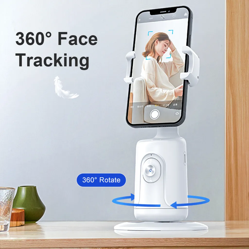 Ein weißer, rotierender Smartphone-Ständer auf einem Holztisch mit Text für Gesichtsverfolgung.