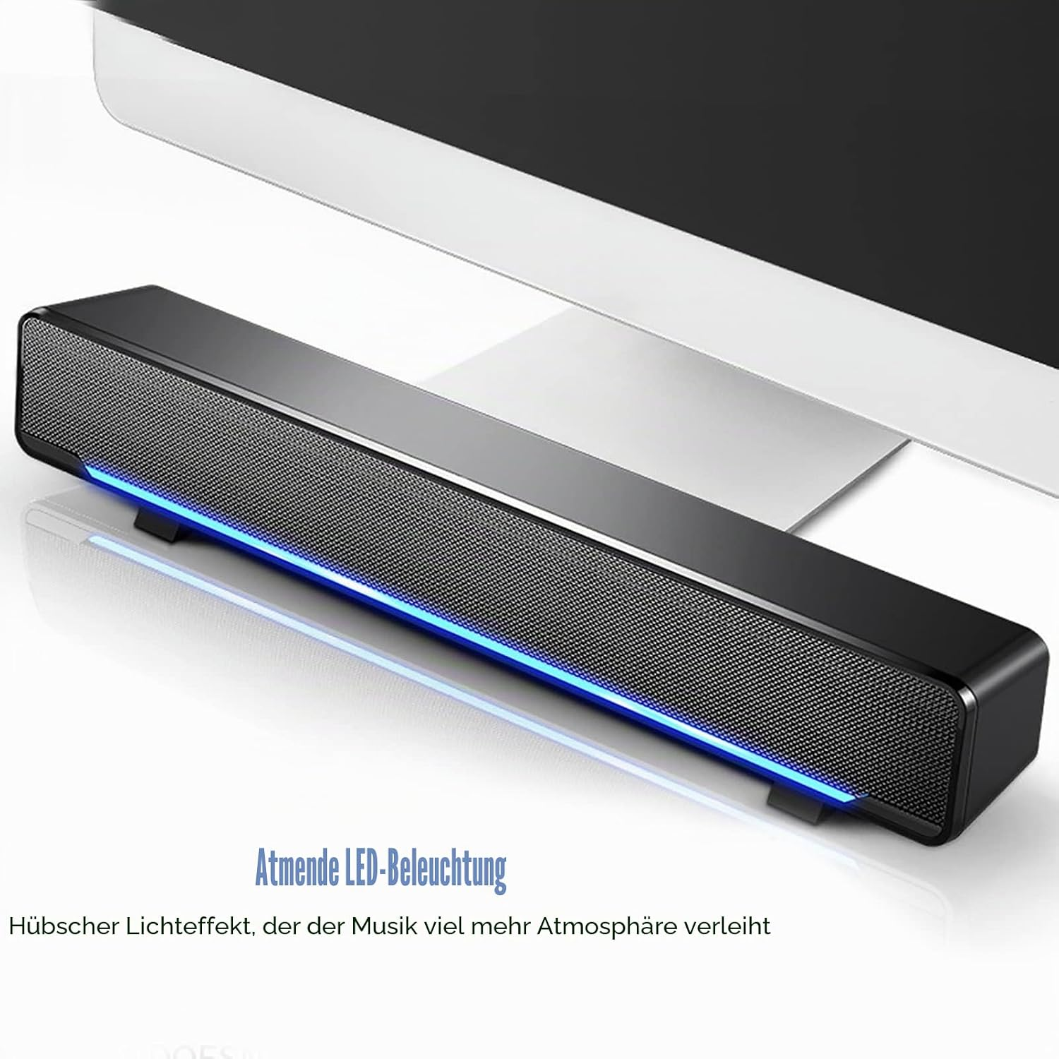Schwarze Soundbar mit blauer LED-Beleuchtung vor einem Computerbildschirm.