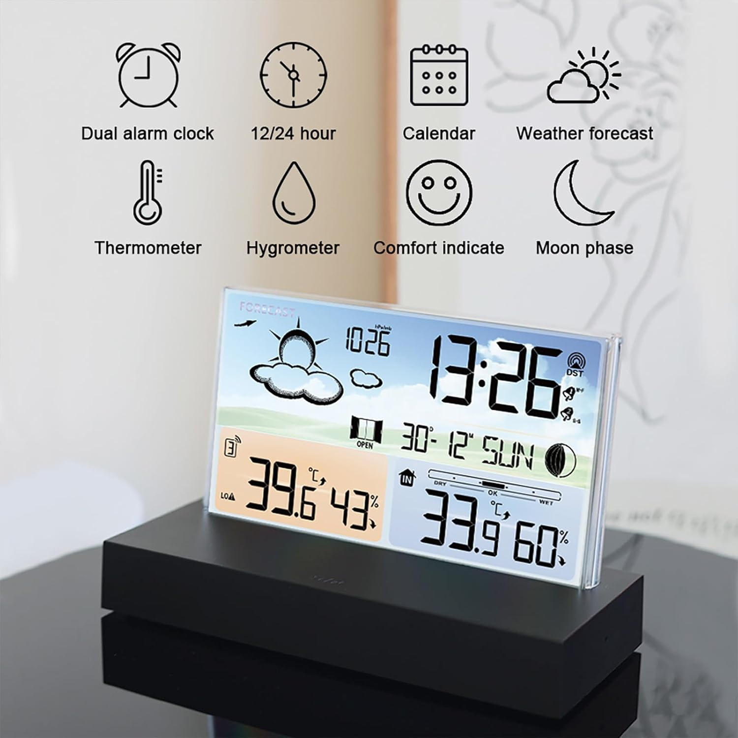 Digitale Wetterstation auf schwarzem Sockel mit Symbolen oben.