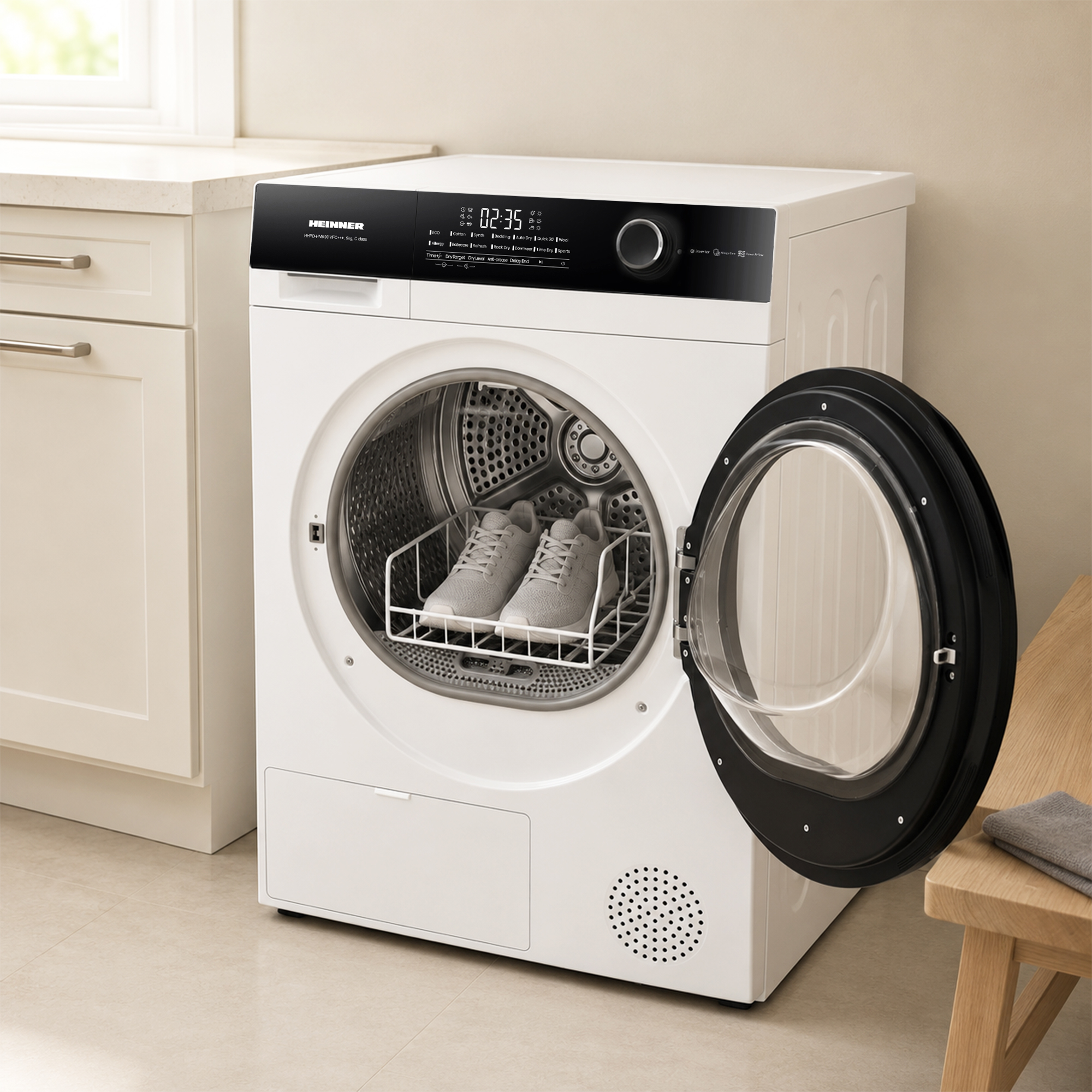 A white tumble dryer with its open door revealing a drying rack containing a pair of grey sneakers inside the drum.