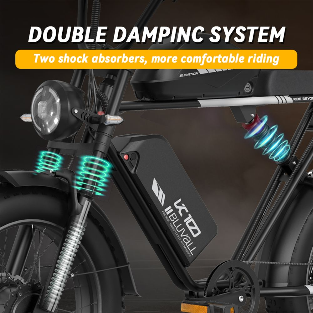Primo piano di una e-bike che evidenzia il doppio sistema di smorzamento con ammortizzatori blu.