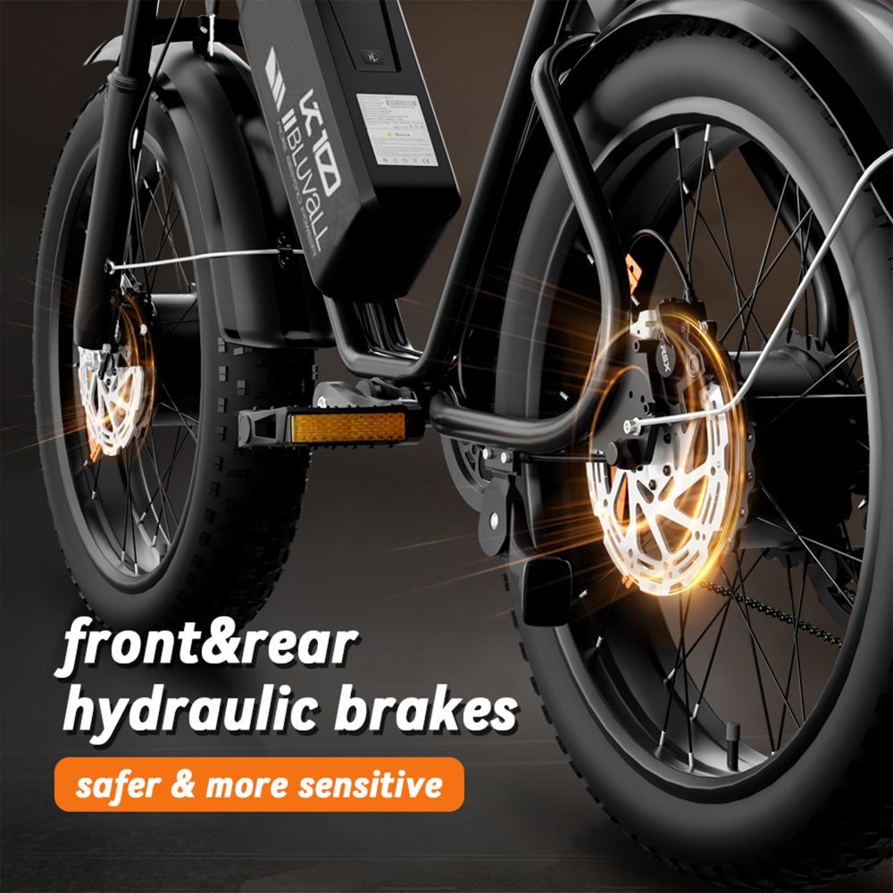 Primo piano di una e-bike con freni a disco idraulici illuminati.