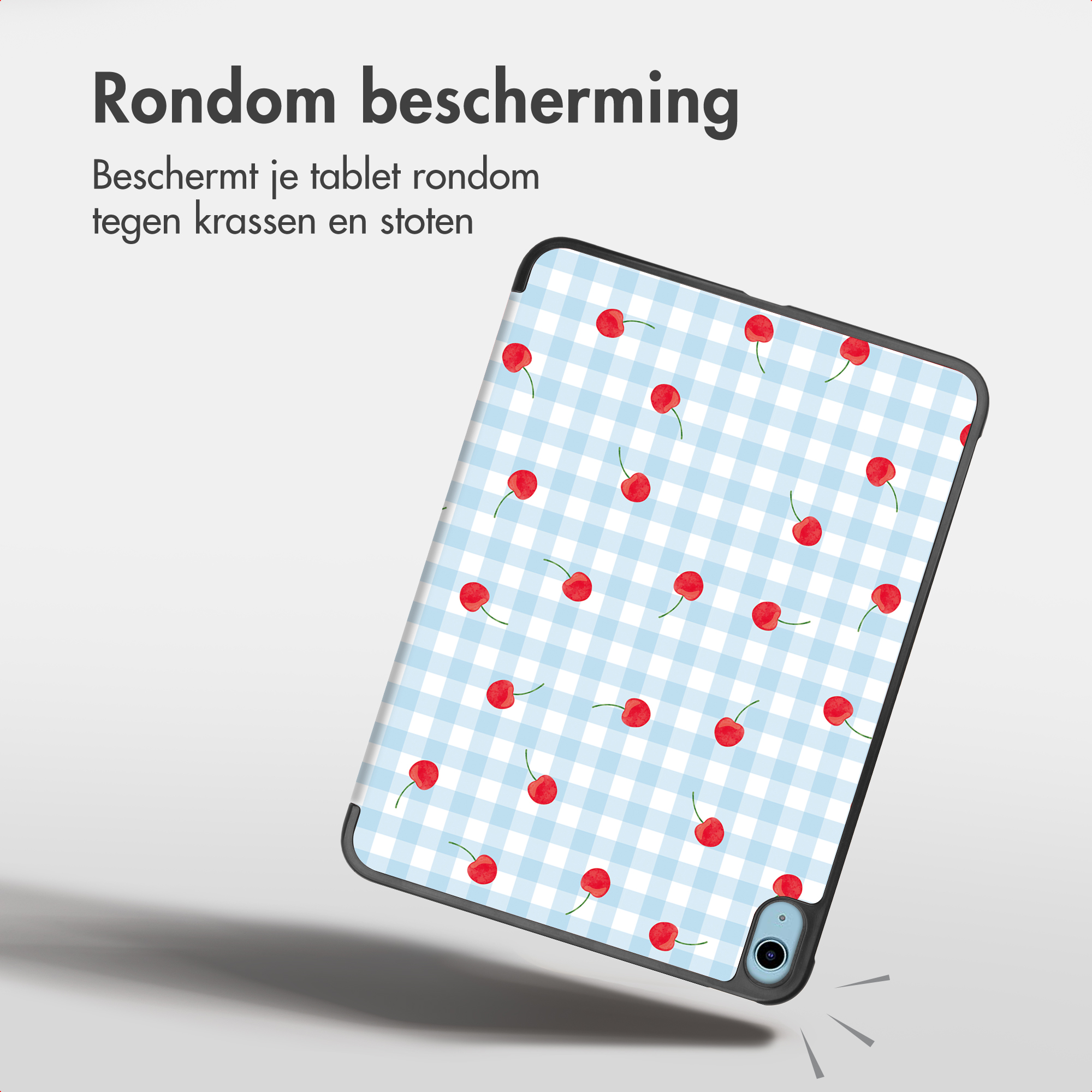 Une tablette dans une coque à carreaux bleus et cerises, près d'un texte néerlandais.