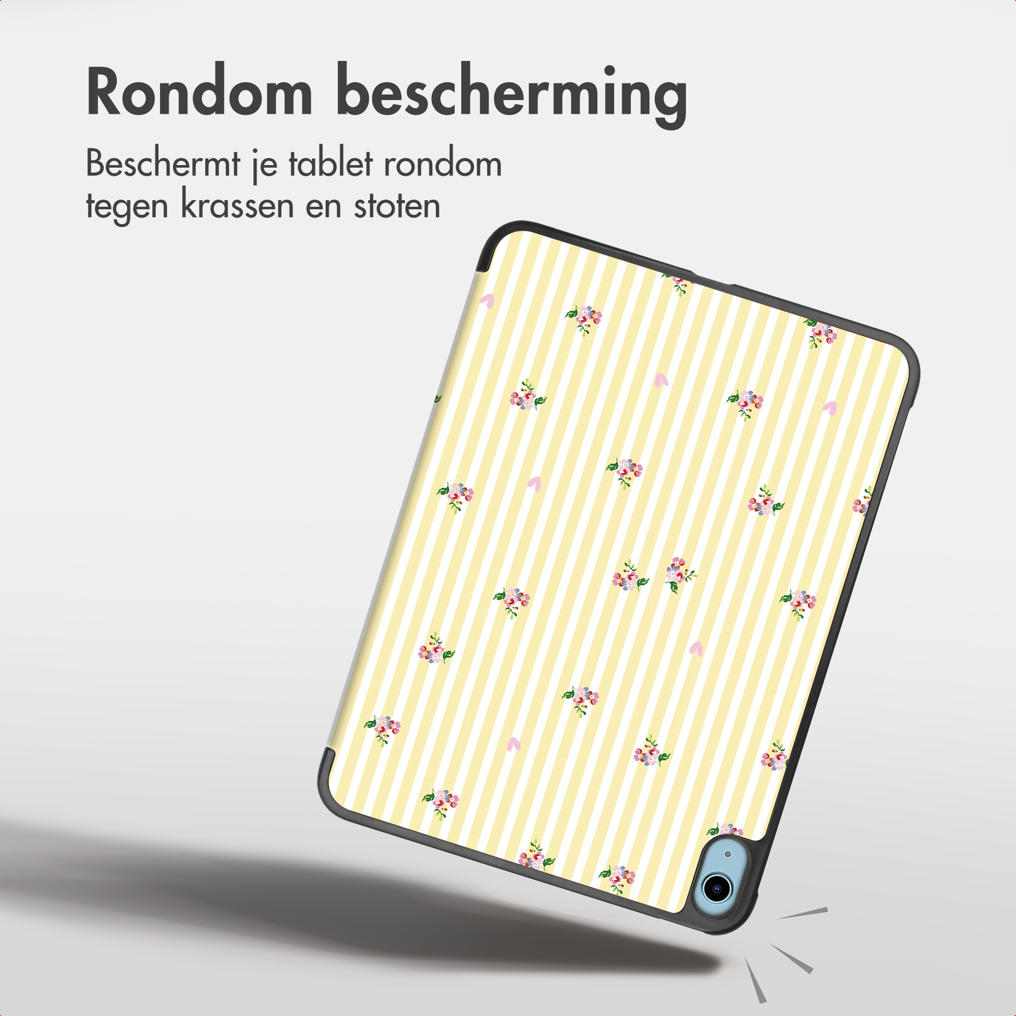 Une tablette dans une coque à rayures jaunes et petits motifs floraux sur fond clair.