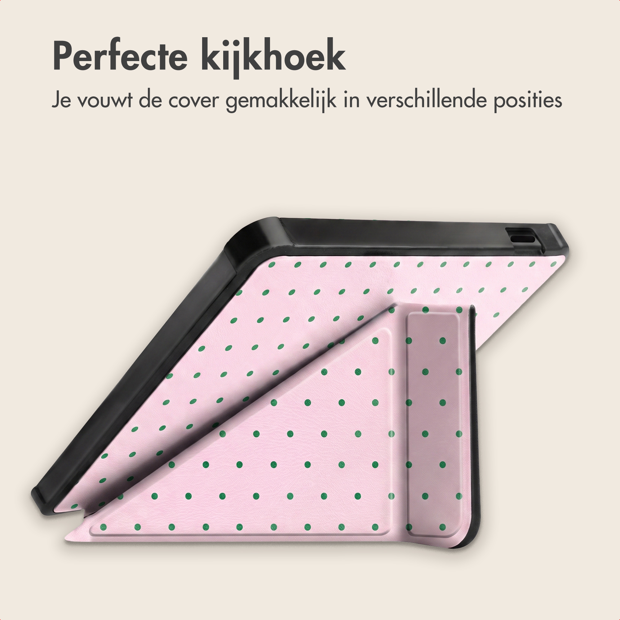 Roze tabletcover met groene stippen als standaard.