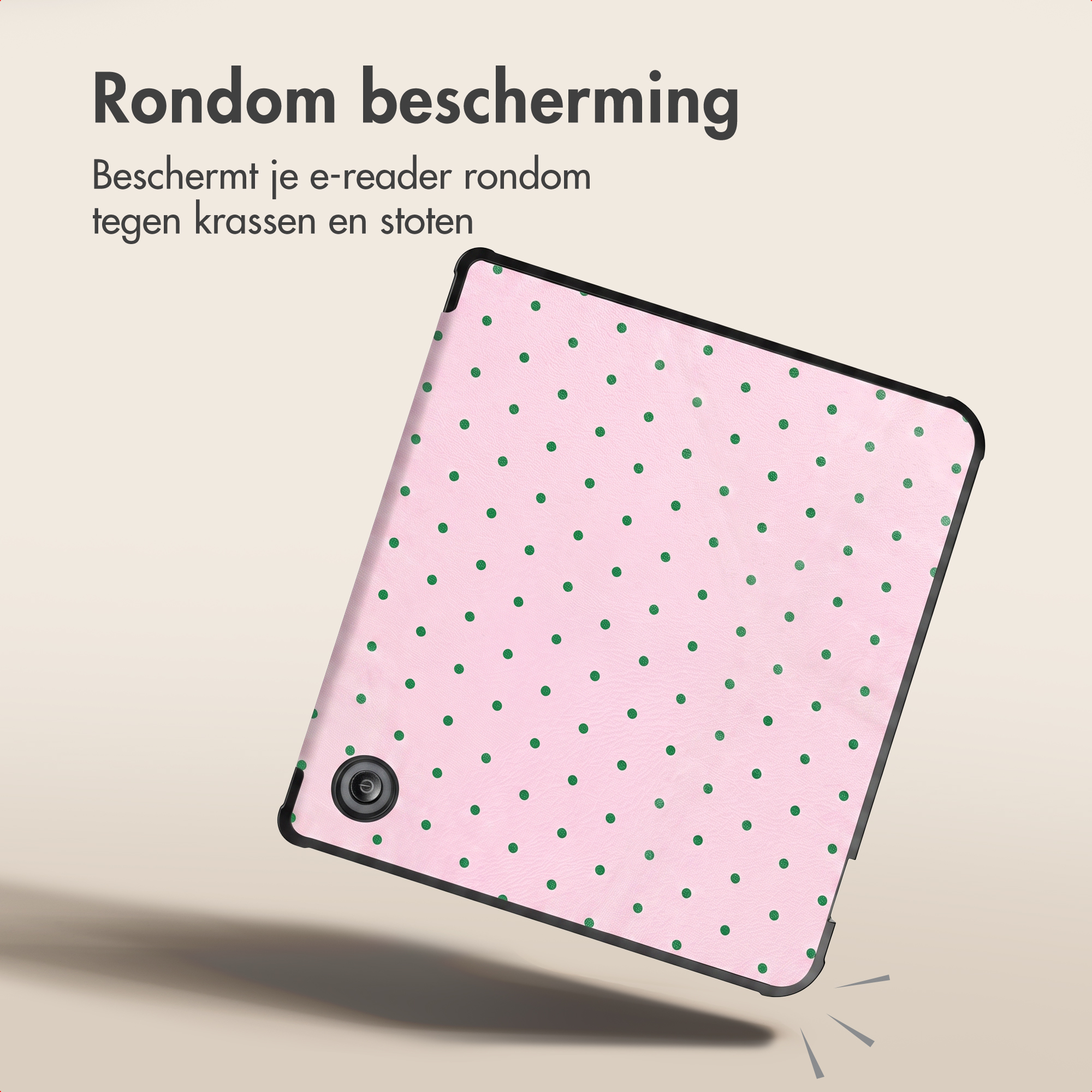 Roze e-reader hoes met groene stippen en zwarte randen, zwevend tegen een lichte achtergrond.