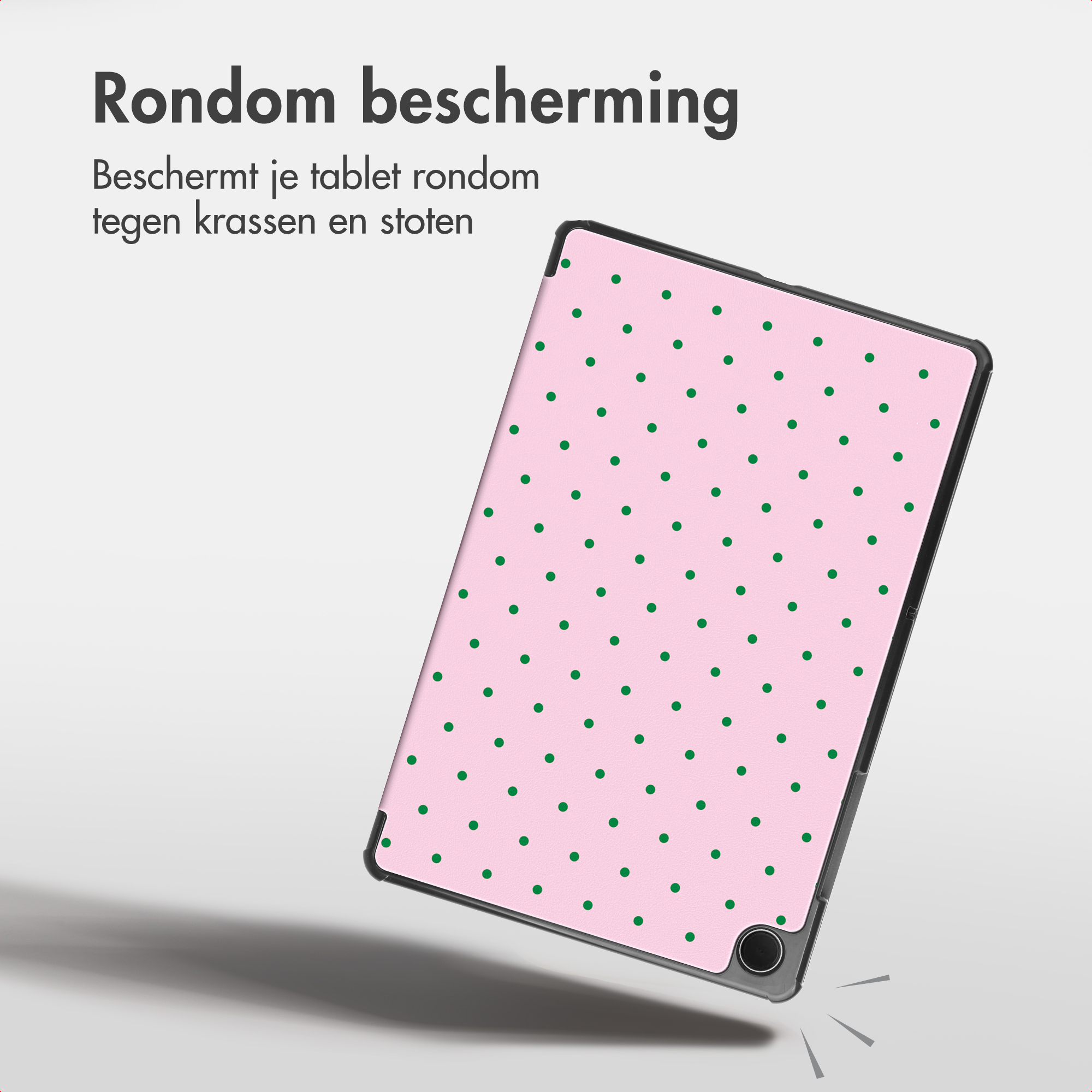 Pink tablet case with green dots and text in top left on light background.