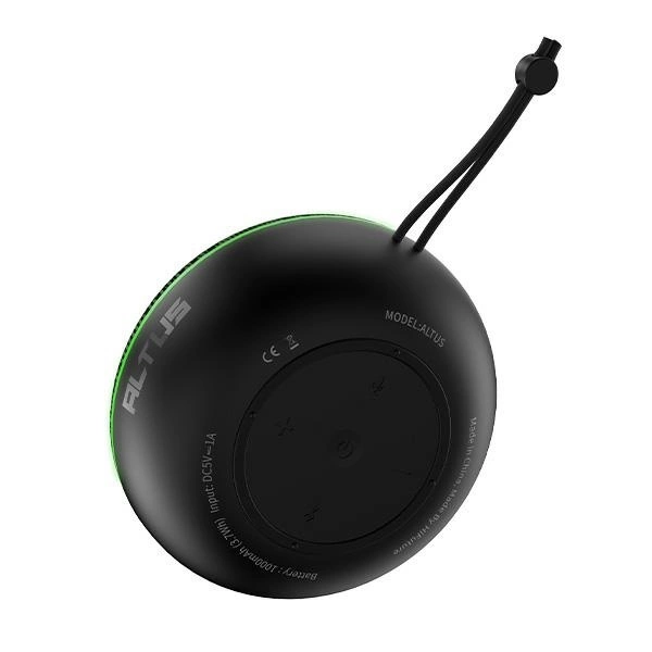 Haut-parleur Bluetooth rond noir avec boutons de commande, sangle et éclairage vert sur fond noir.