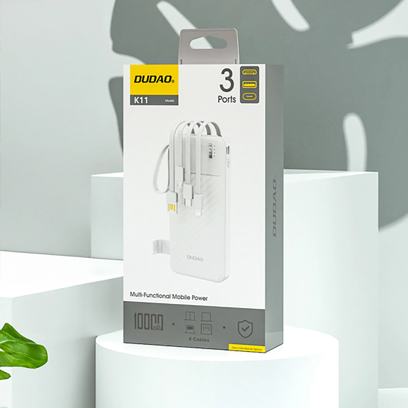 Scatola power bank Dudao K11 con tre cavi di ricarica integrati in design bianco.