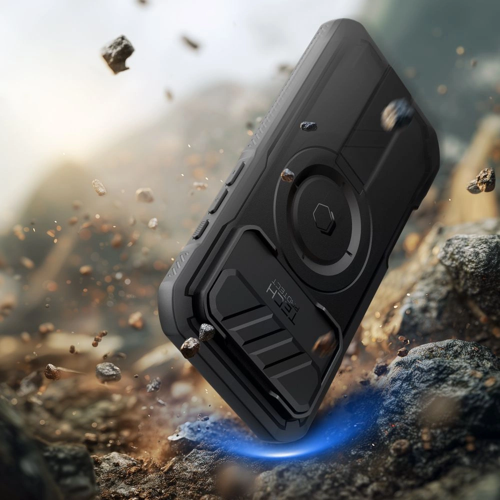 Ein schwarzes Schutzsmartphone fällt auf felsigen Boden, umgeben von schwebenden Steinen.