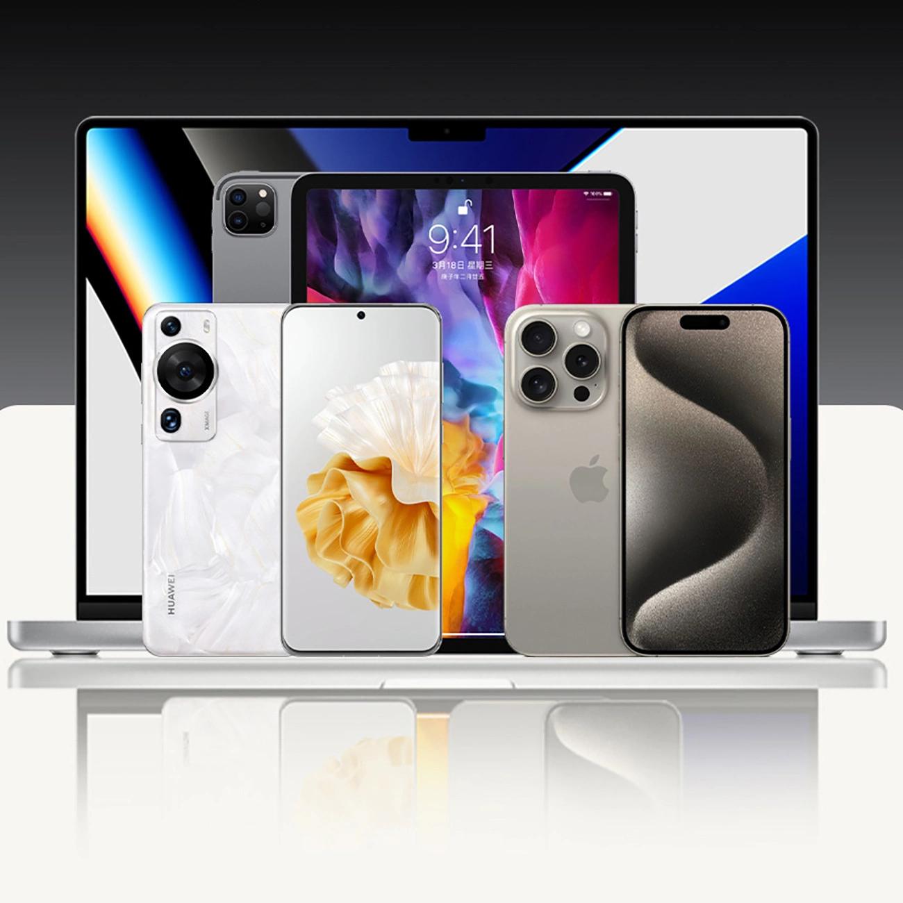 Mehrere Smartphones und ein Tablet stehen vor einem geöffneten Laptop auf einer hellen Oberfläche.