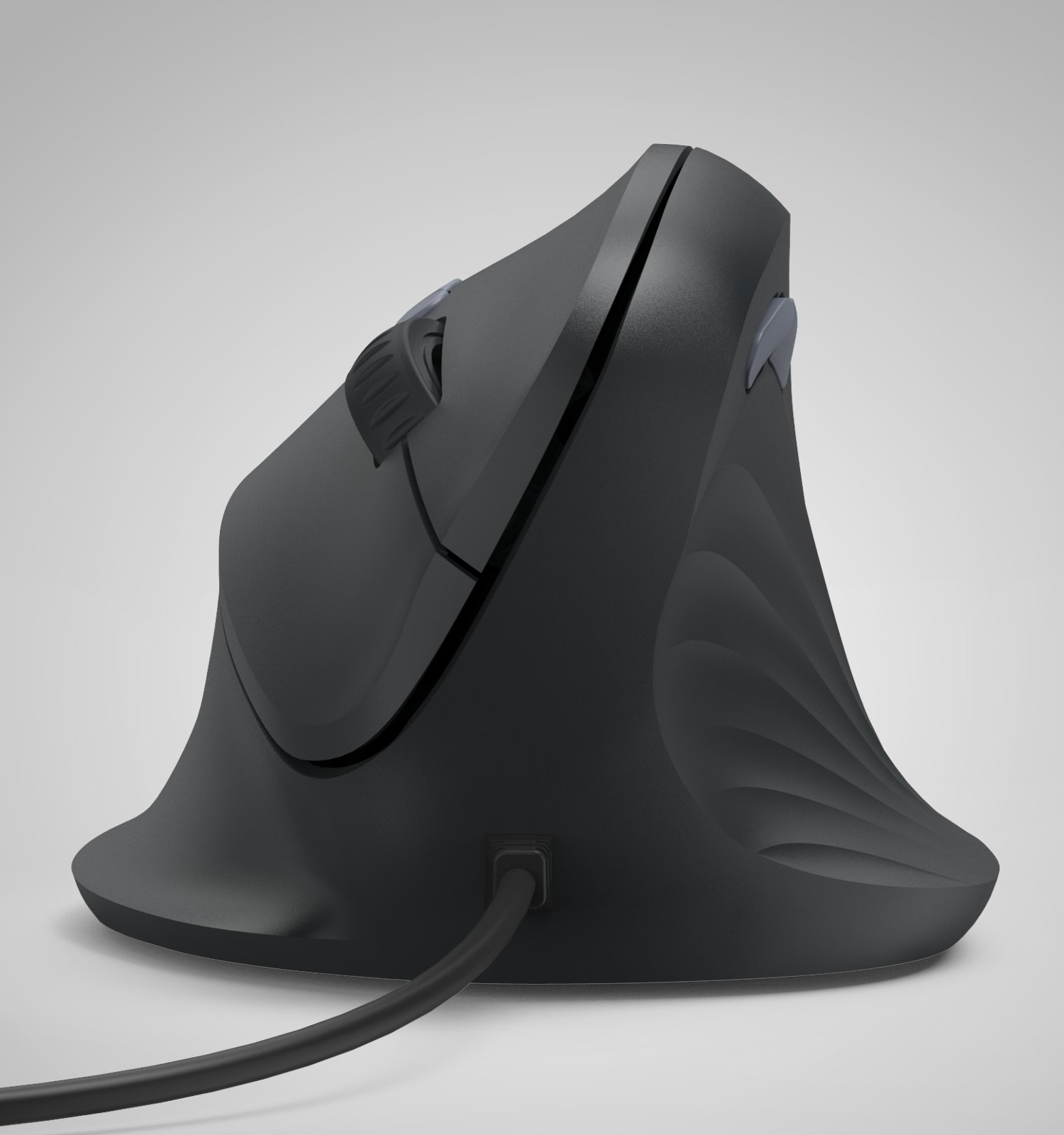 Un mouse verticale ergonomico nero con filo si trova su una superficie chiara.