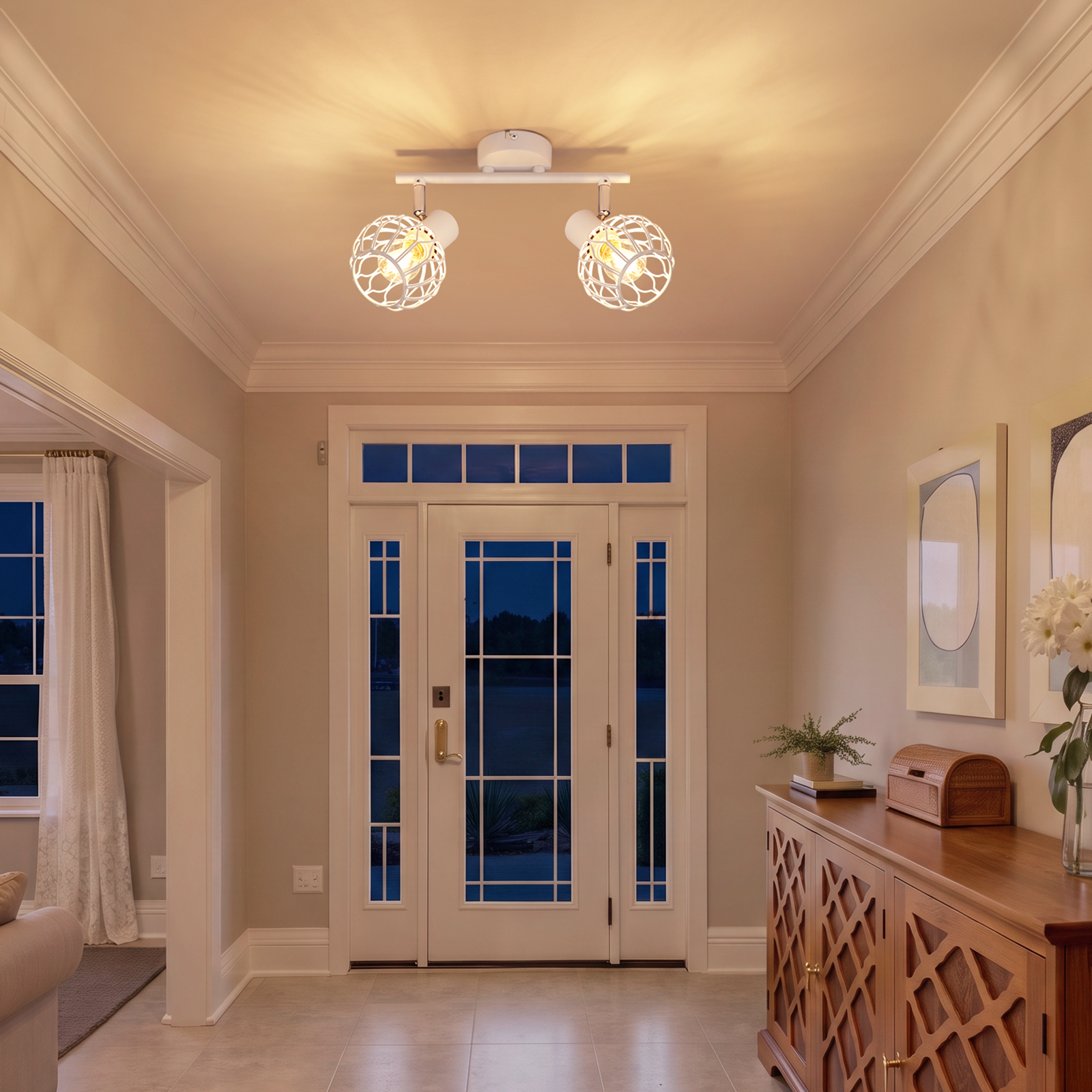 Una lámpara de techo de dos luces ilumina un pasillo con puerta principal blanca y armario de madera.