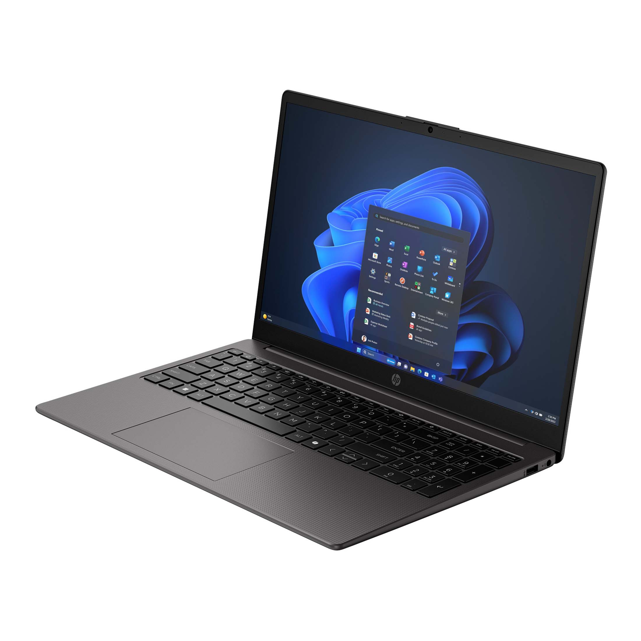 Ein grauer HP-Laptop steht auf einer weißen Oberfläche und zeigt das Windows-Startmenü auf dem Bildschirm.