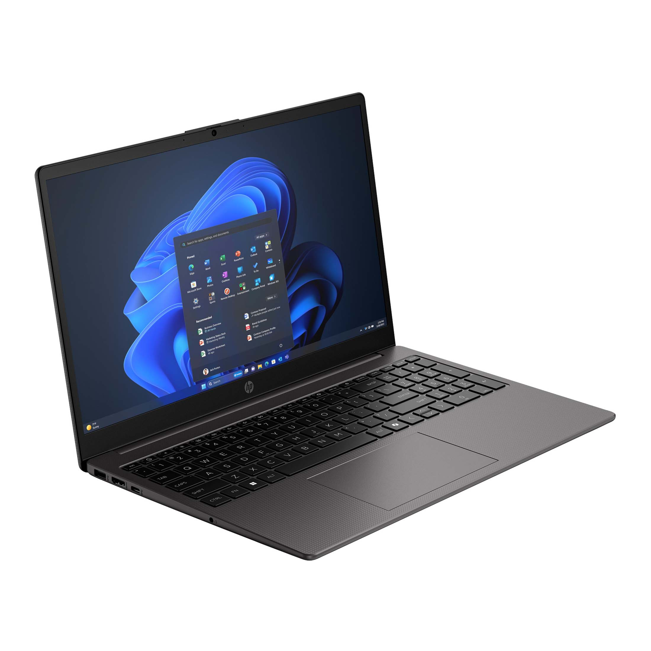 Ein dunkelgrauer Laptop ist auf einer weißen Oberfläche geöffnet und zeigt einen blauen Windows 11-Desktop.
