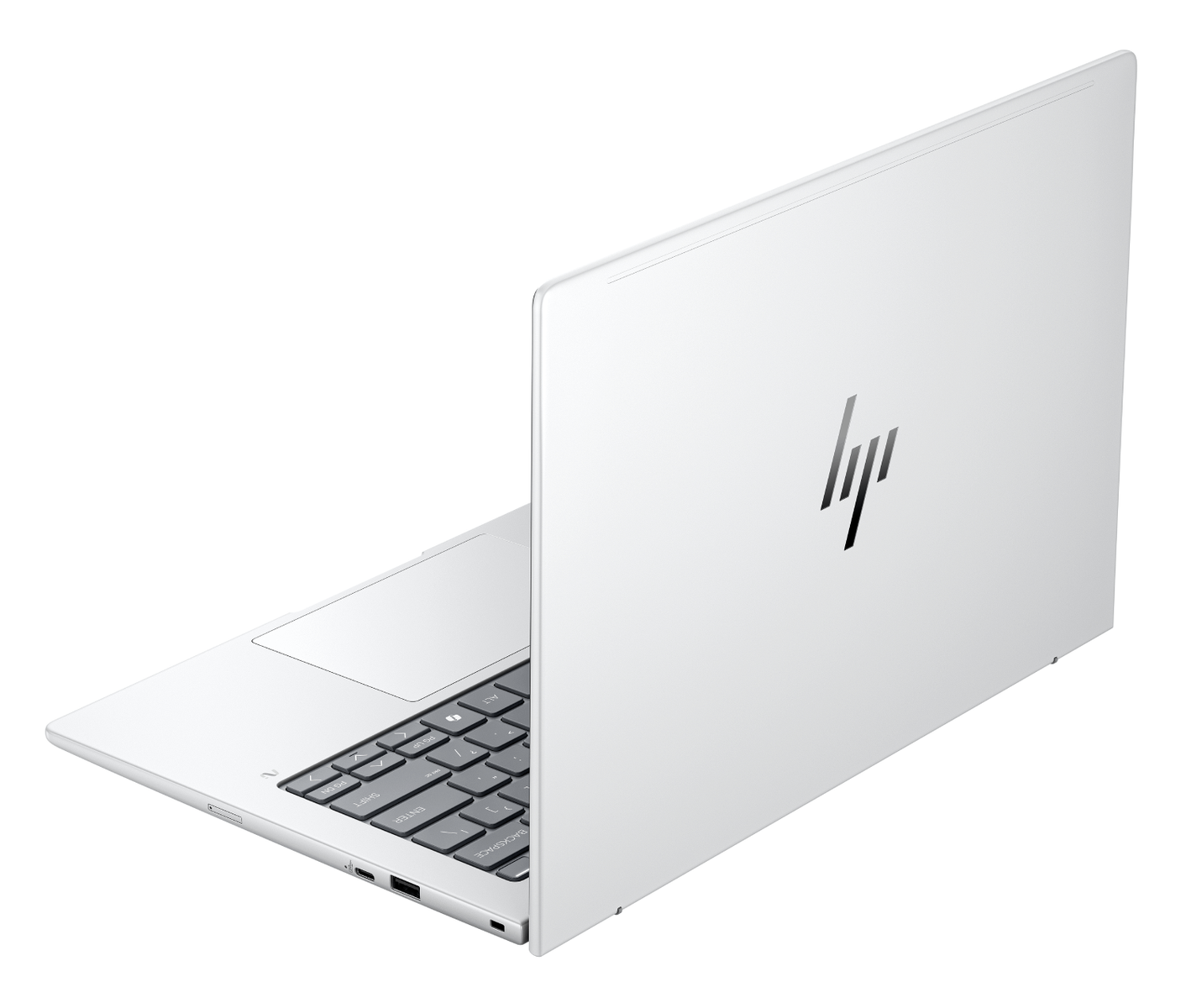 Se muestra una laptop plateada cerrada sobre una superficie blanca, con el logotipo de HP.