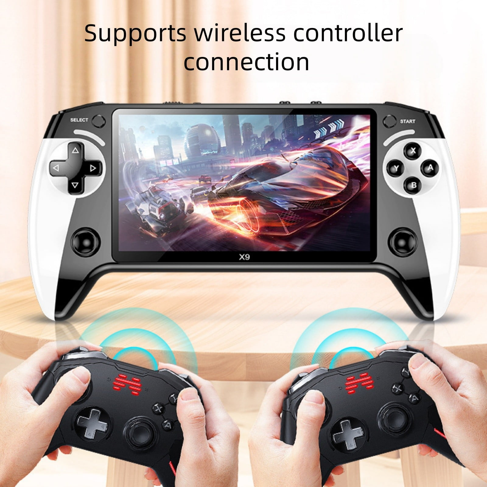 X9-Handheld-Konsole auf einem Tisch, verbunden mit zwei drahtlosen Controllern.