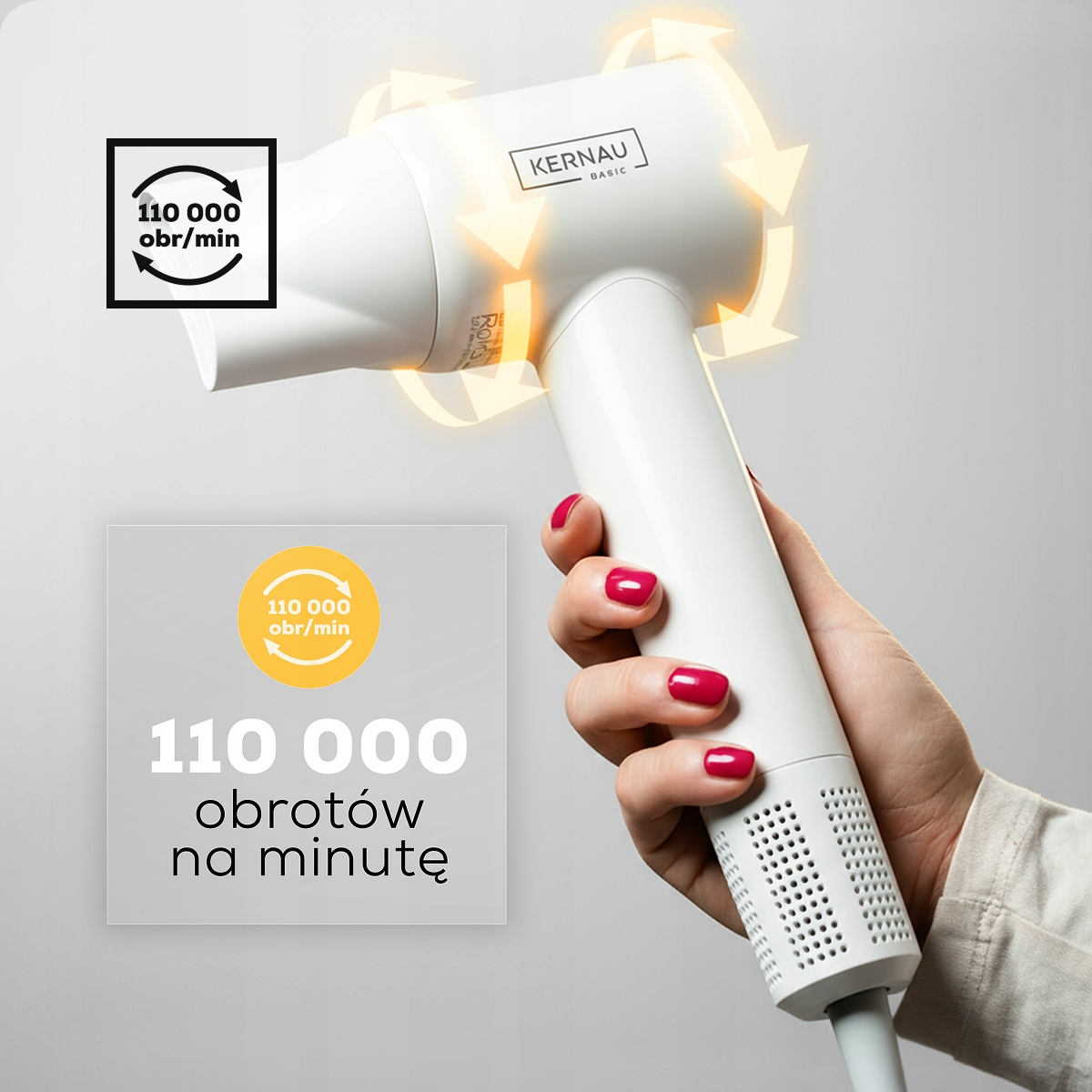 Dłoń z czerwonym lakierem trzyma białą suszarkę Kernau o mocy 110 000 obr/min.