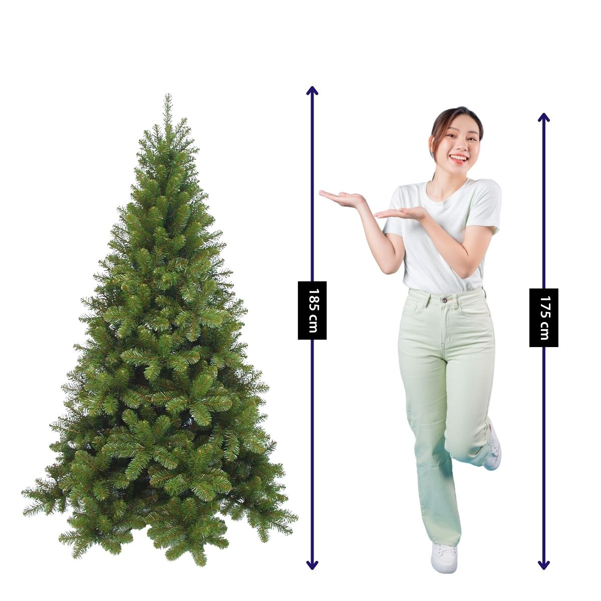 A woman gestures toward an artificial Christmas tree, 185 cm tall, next to her.