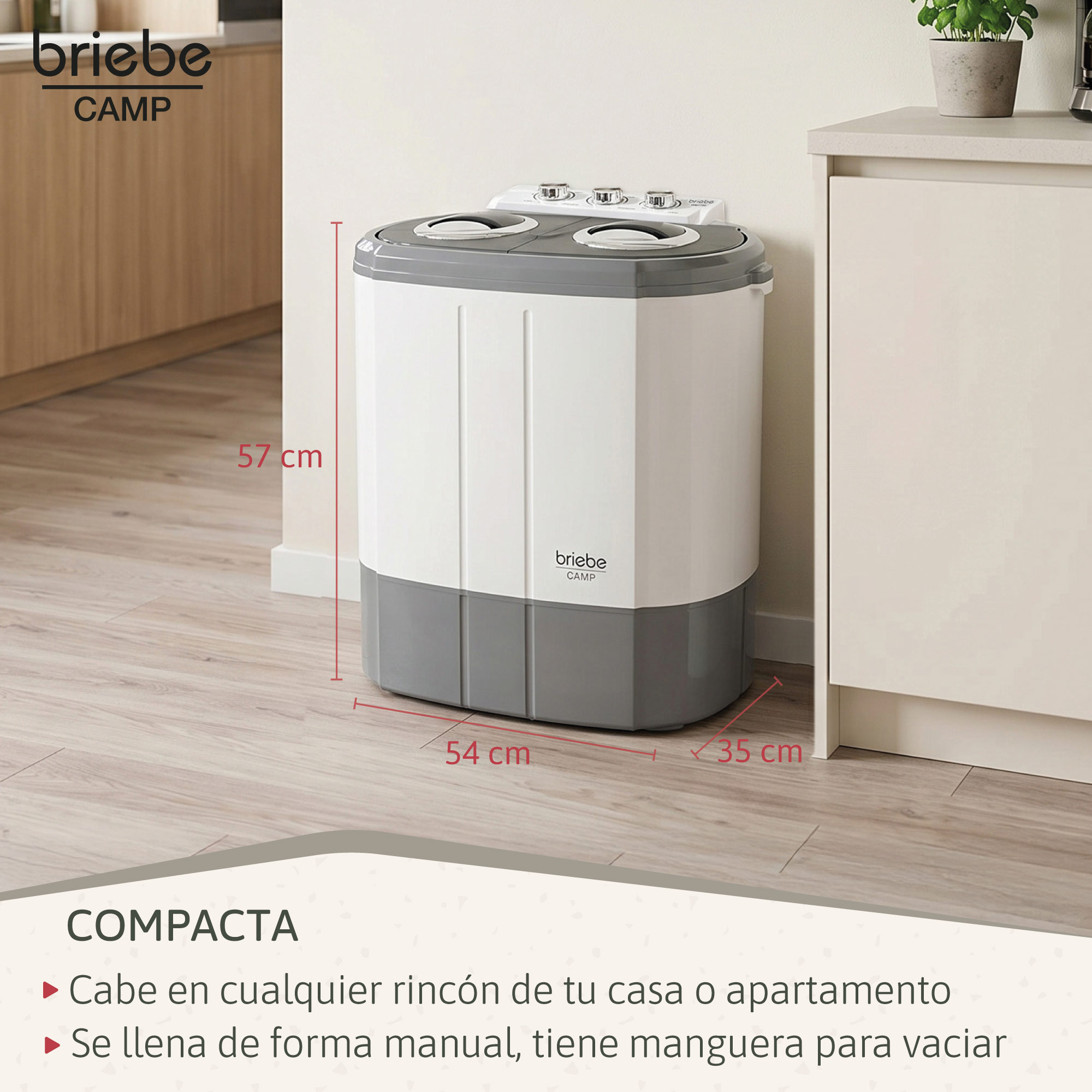 Lavadora de camping compacta blanca y gris con dimensiones en suelo de madera.